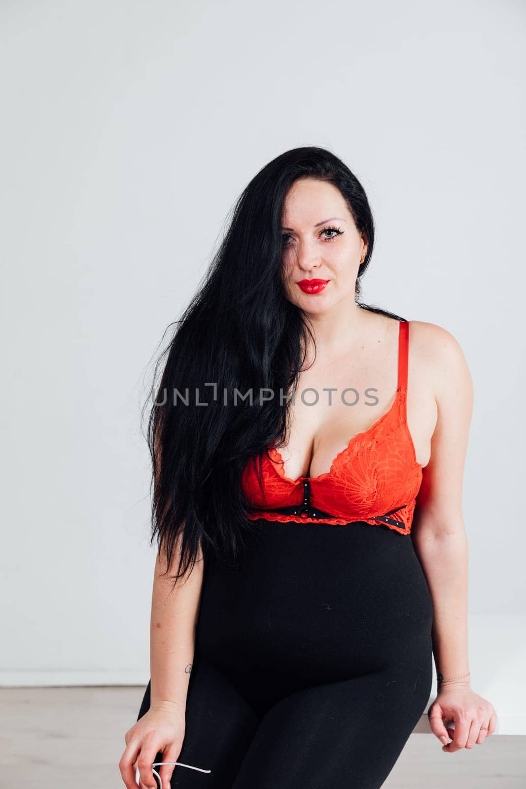 Fat woman posing on white background by Simakov