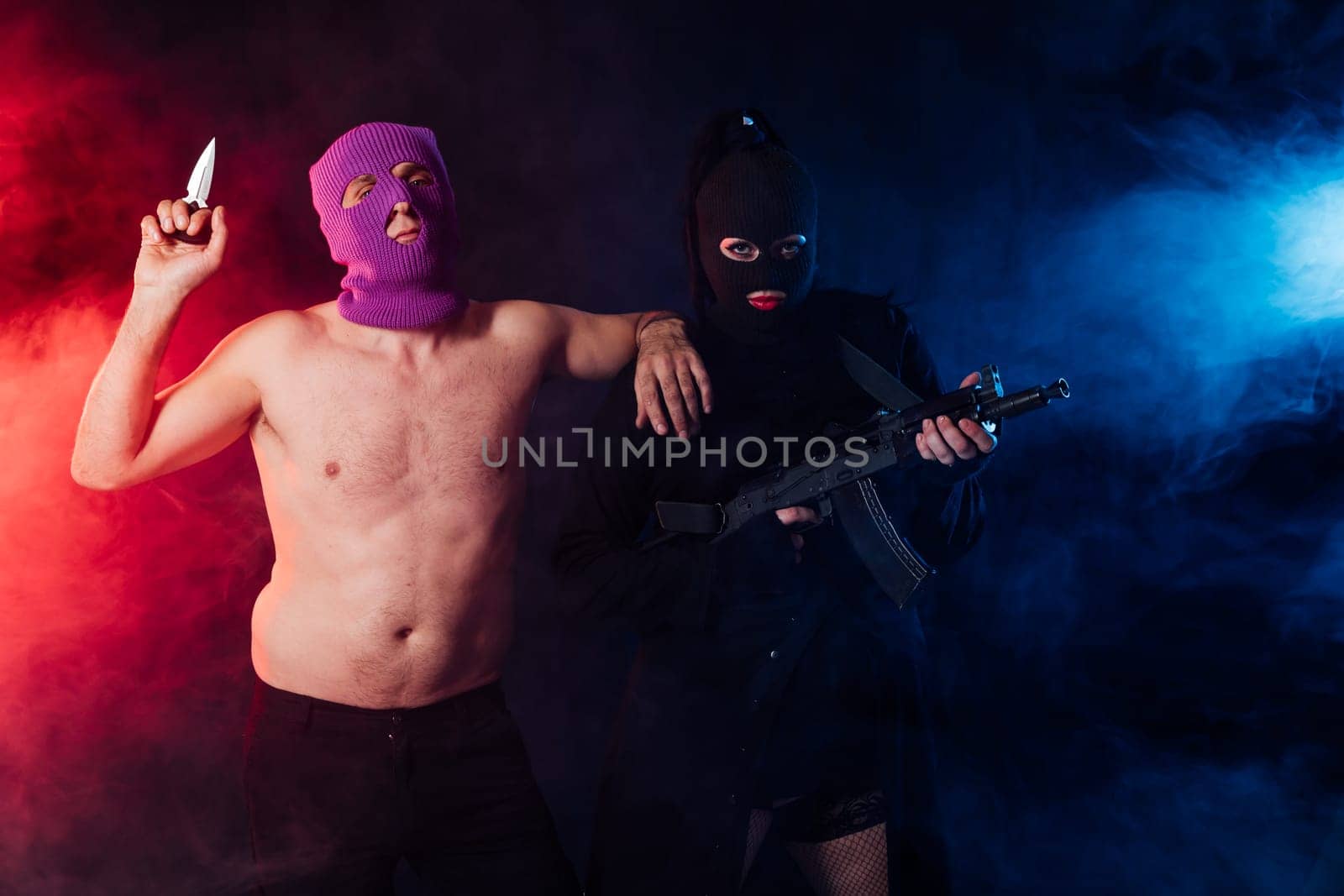 masked terrorists with weapons in the smoke by Simakov
