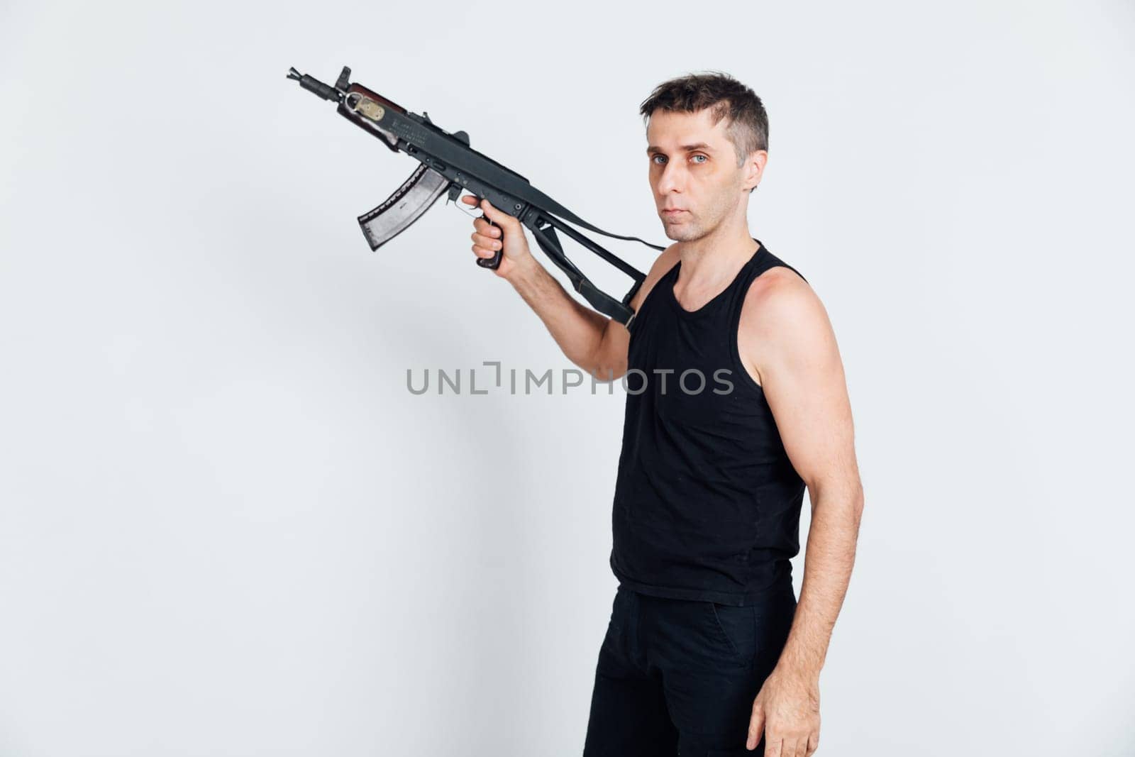 A man with a machine gun on a white background by Simakov