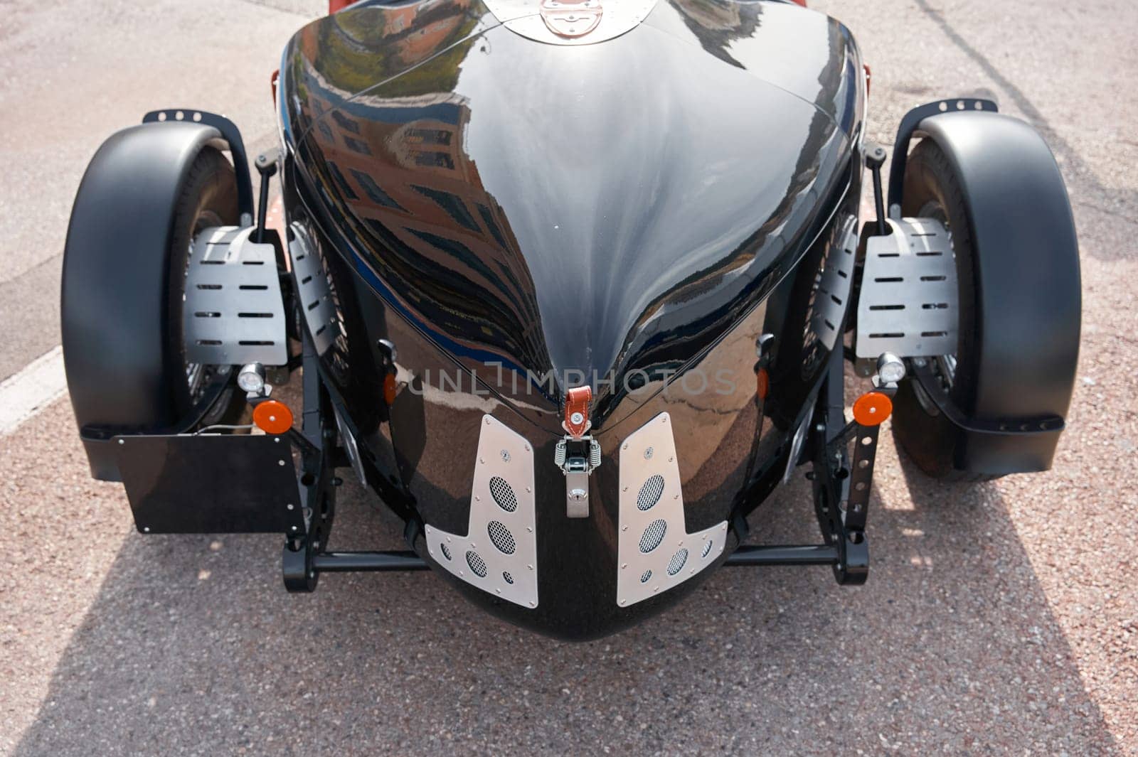 vintage open-top car at the yacht show in Monaco on a sunny day, leather seats, spoked wheels, close-up. High quality photo