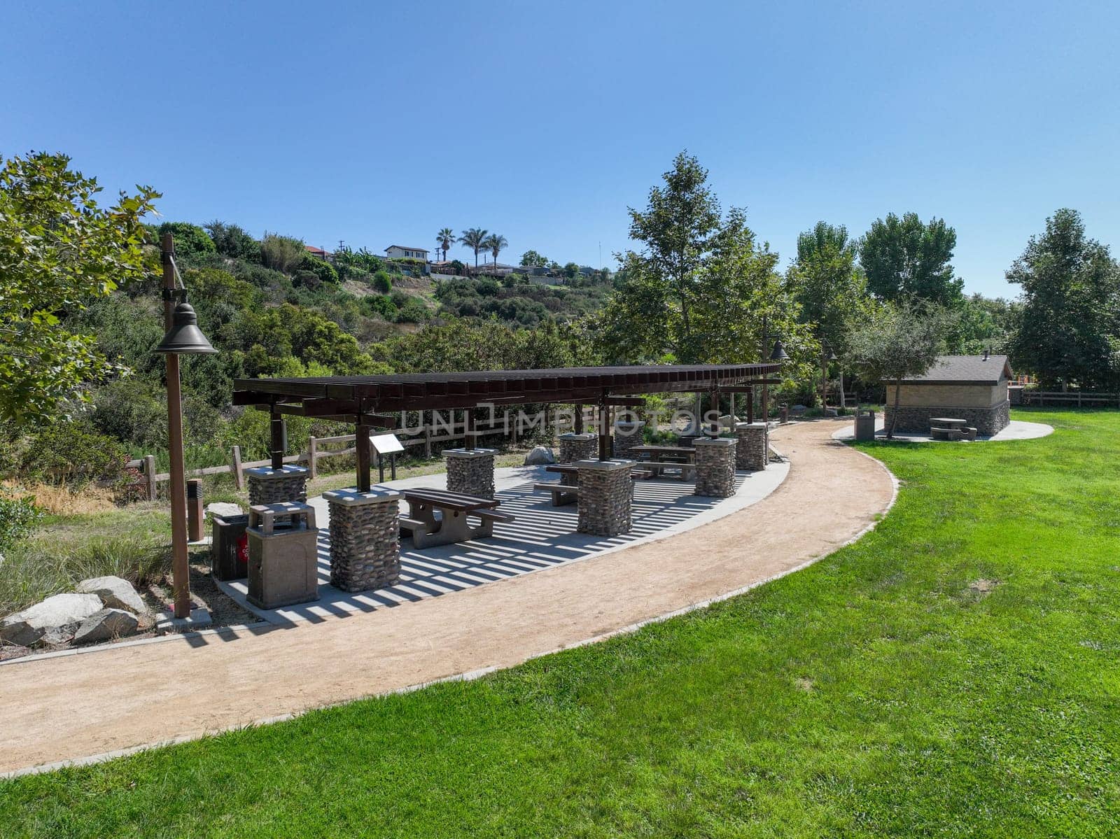 Recreational facilities with table and barbecue in residential community park in Califronia by Bonandbon