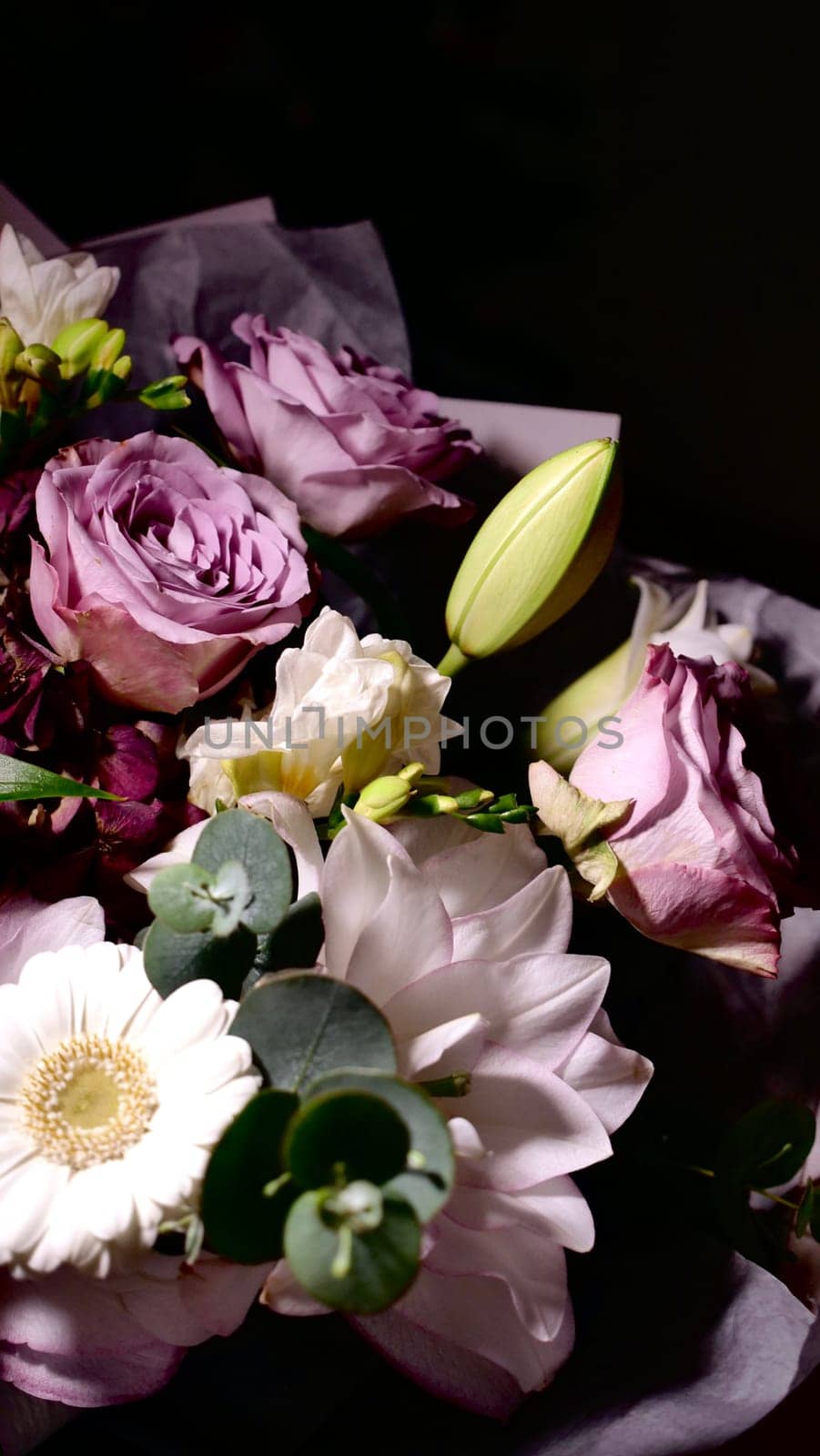 Rotating spring summer floral pastel arrangement in the background close up. Celebrating Mother's Day, International Women's Day March 8. Flowers gardenia, rose, Lilia, eucalyptus