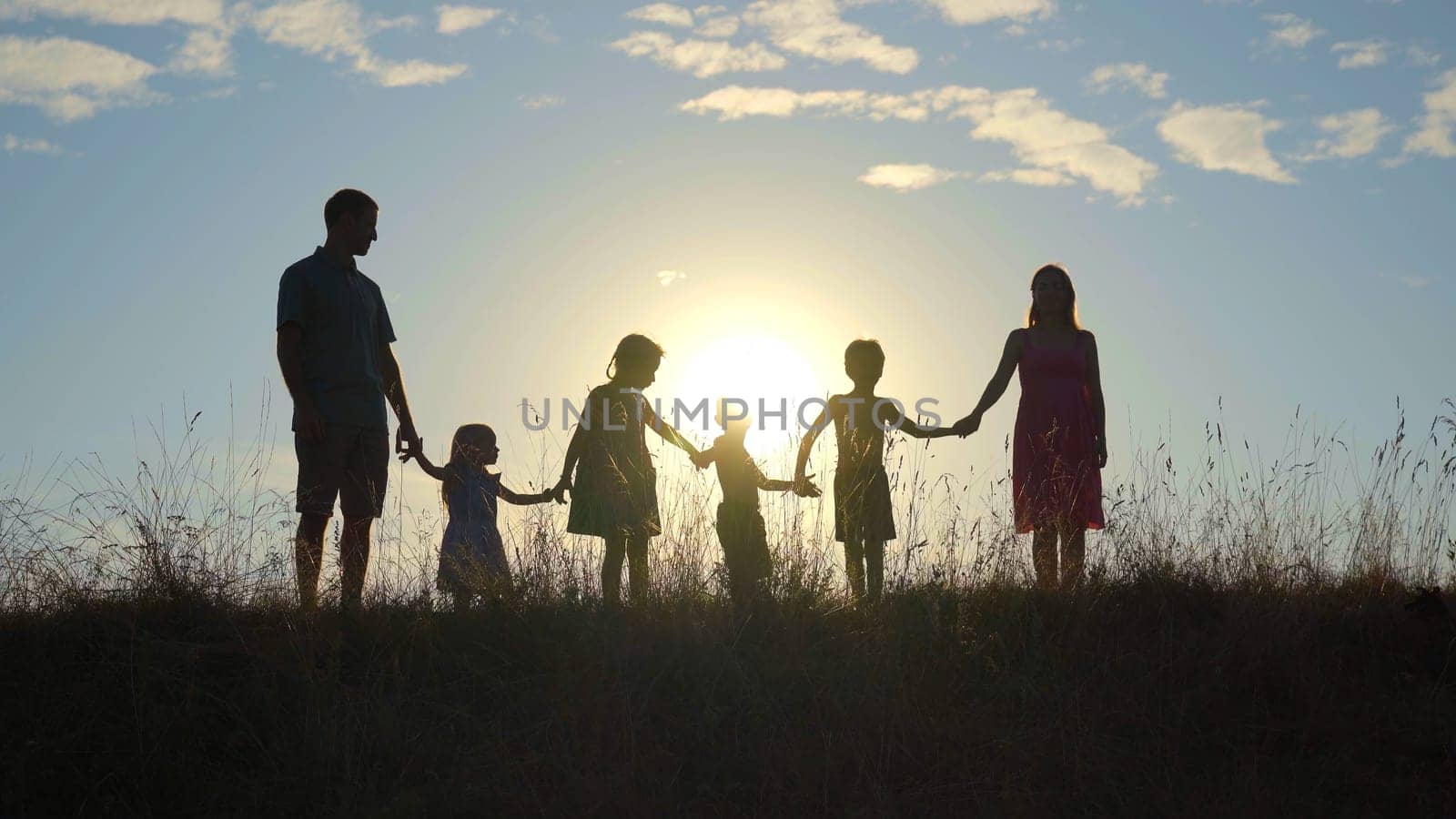 Happy large family at sunset with a dog. by DovidPro