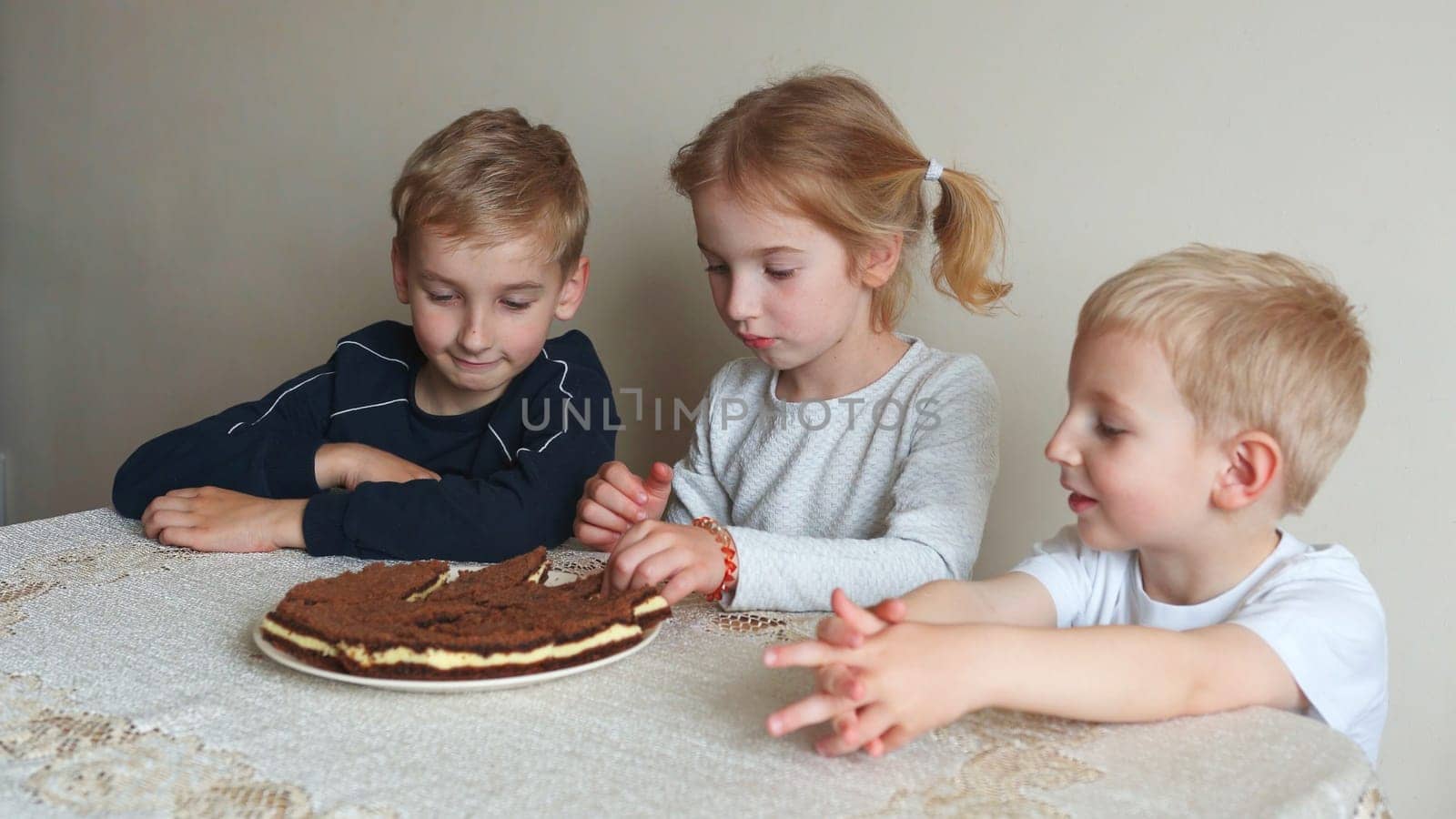 Happy children are getting ready to eat cakes. by DovidPro