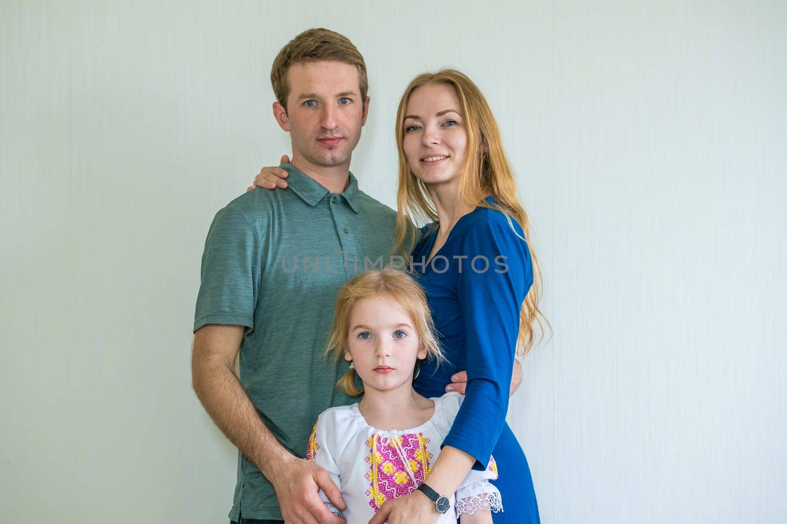 Portrait of a young Russian family with a young daughter