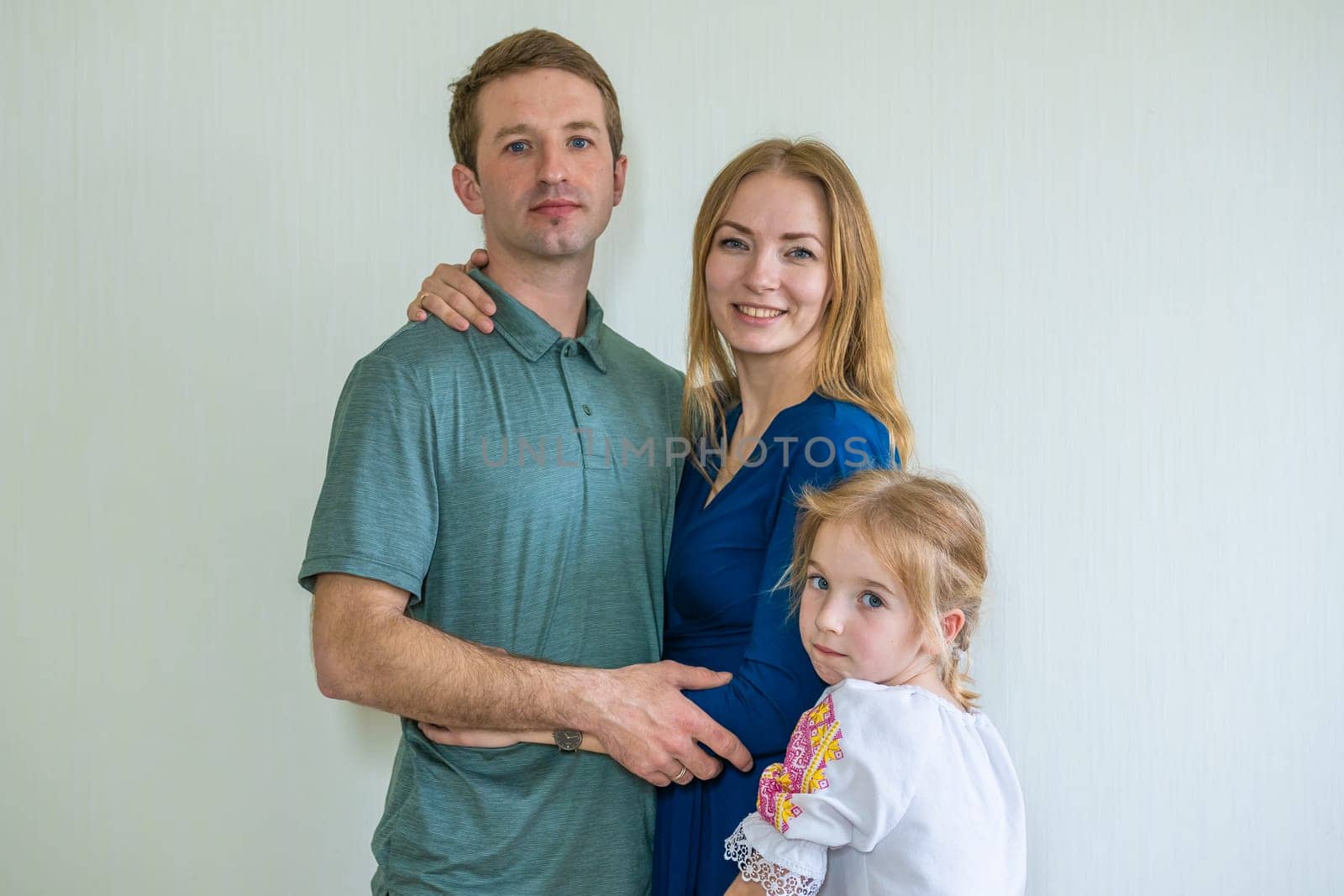 Portrait of a young Russian family with a young daughter. by DovidPro