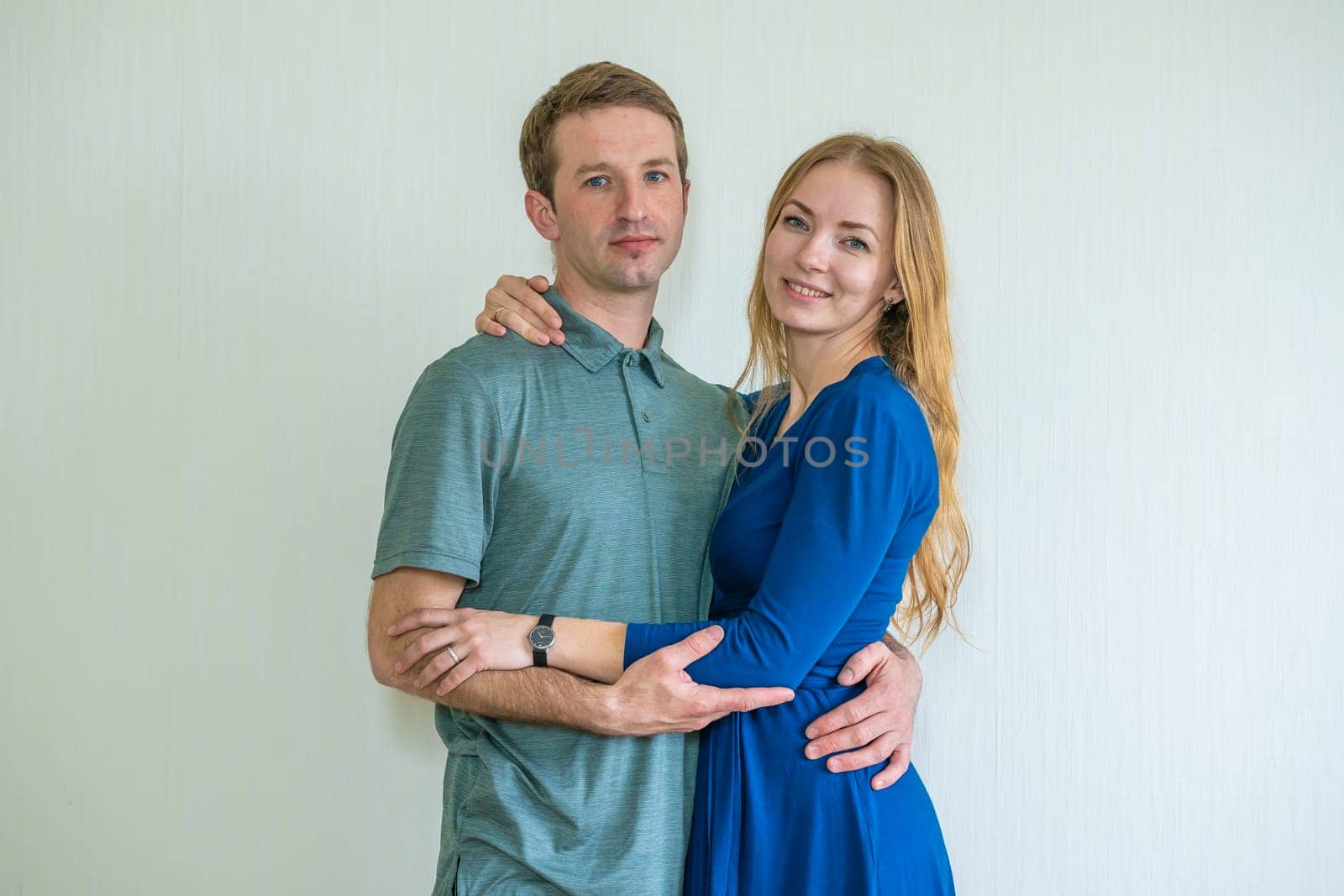 Portrait of happy young spouses at home. by DovidPro