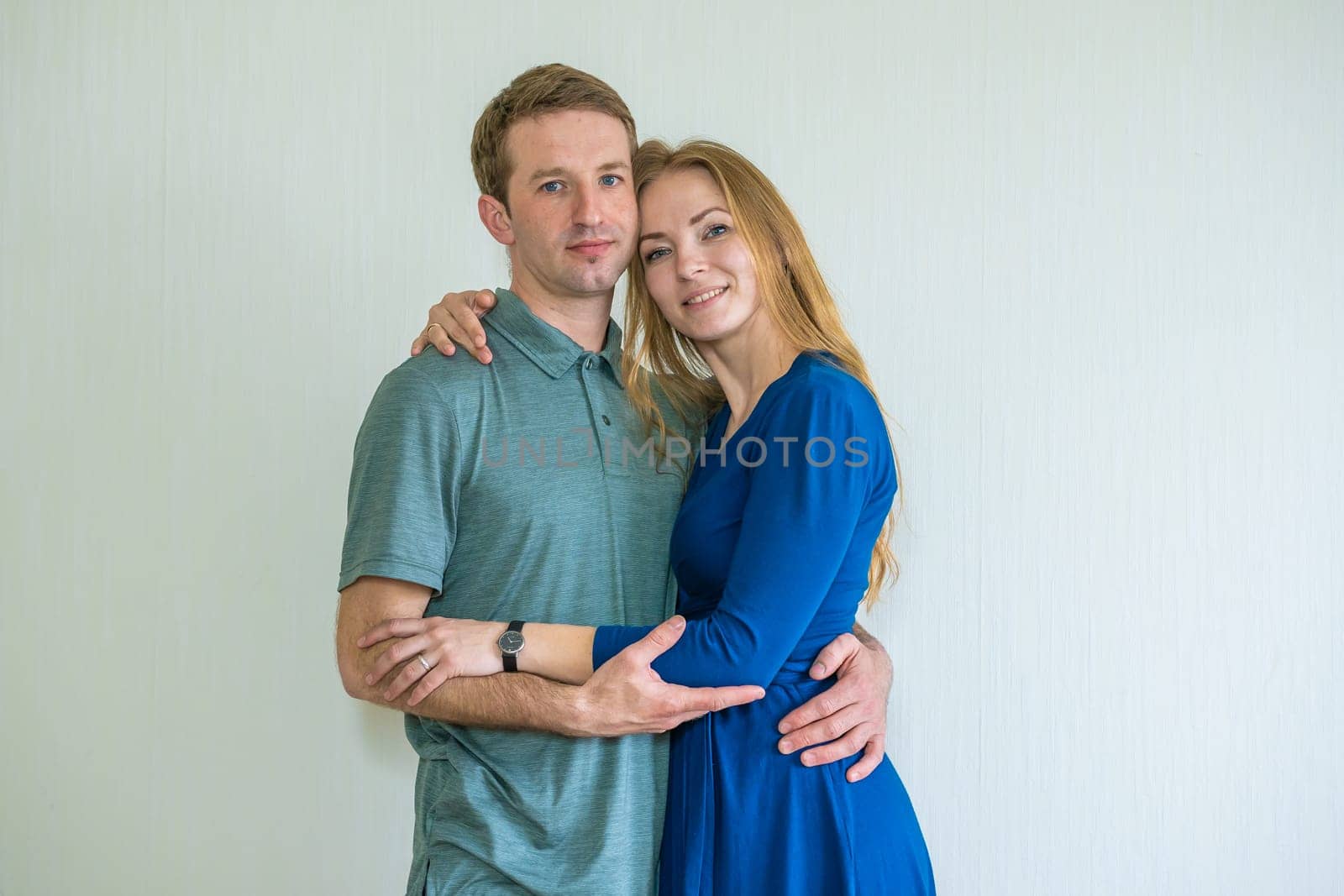 Portrait of happy young spouses at home