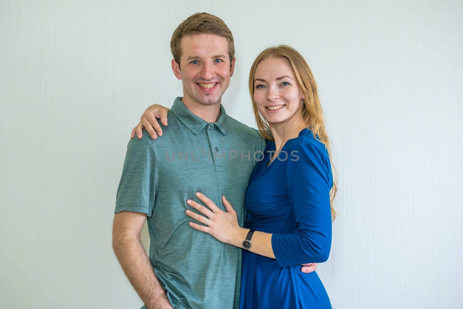 Portrait of happy young spouses at home