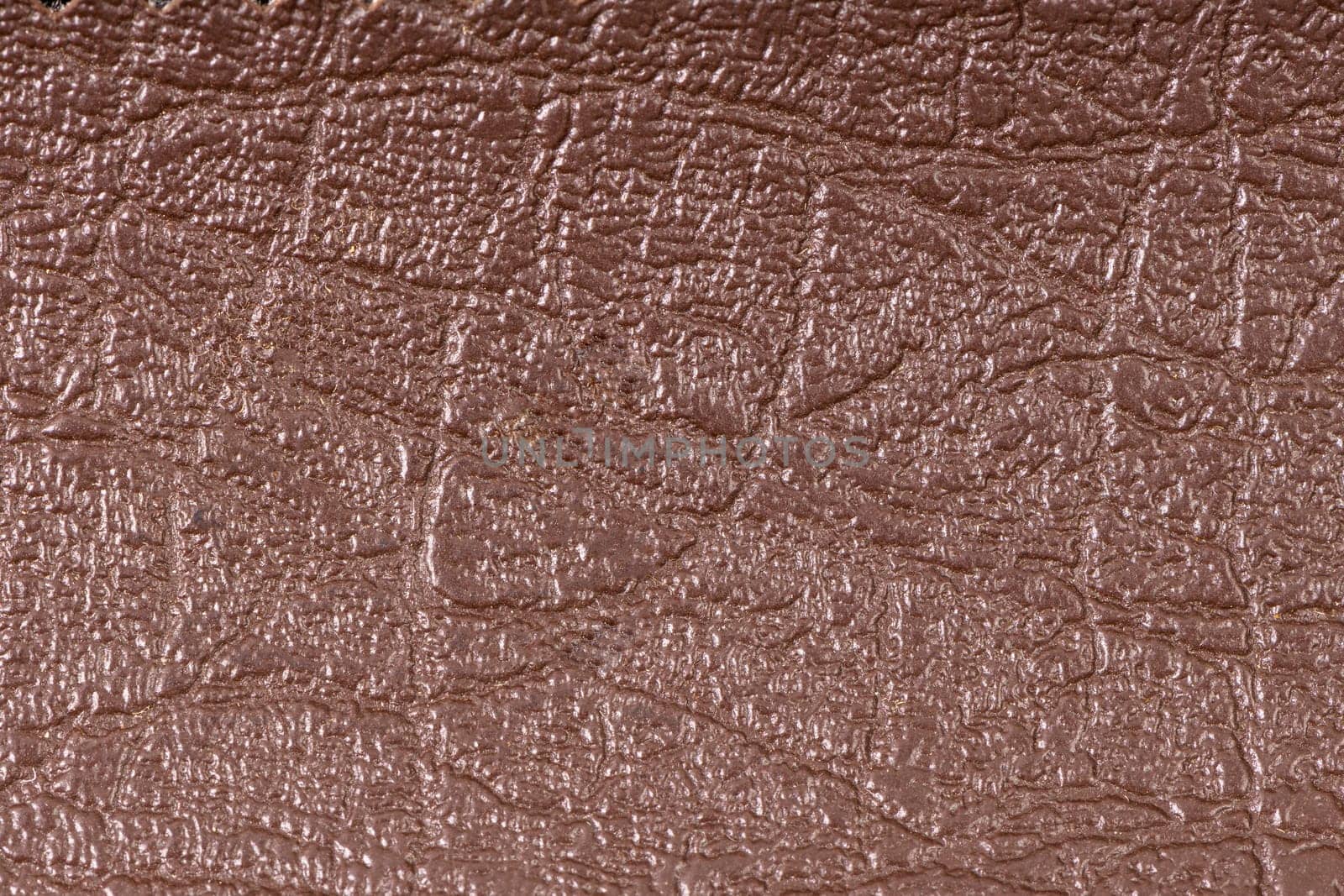 Closeup of detailed brown leather texture background.