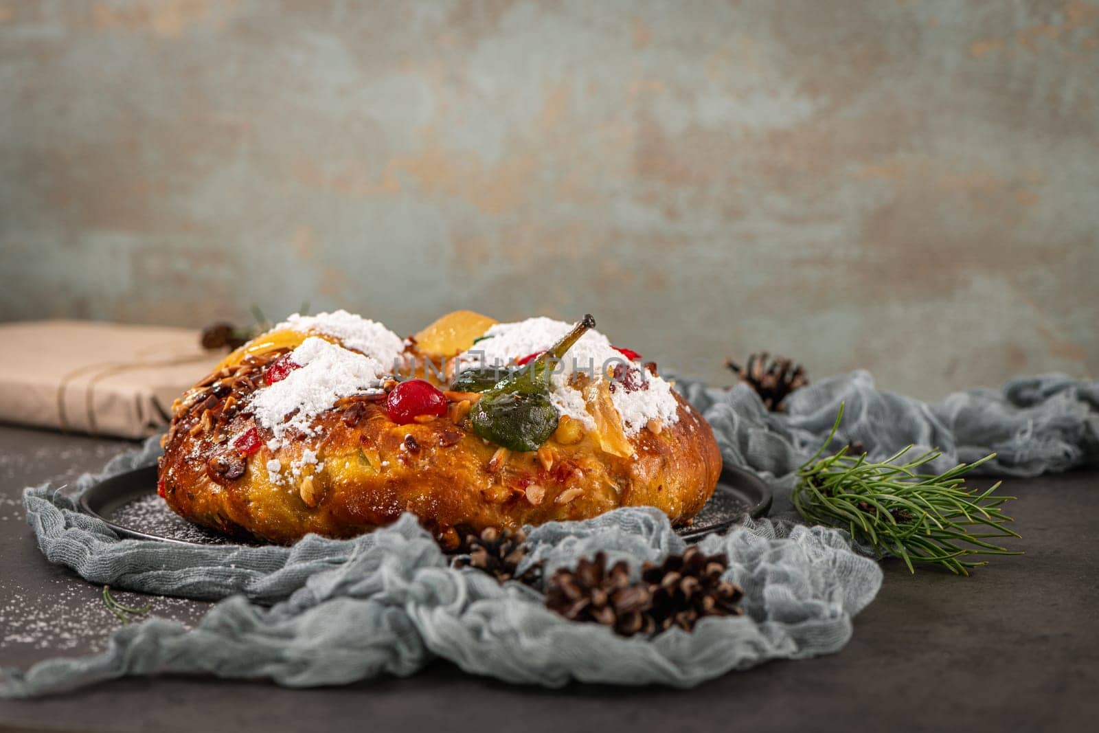 Bolo Rei or Kings Cake is a traditional Xmas cake with fruits raisins nut and icing on kitcthen countertop. Is made for Christmas, Carnavale or Mardi Gras