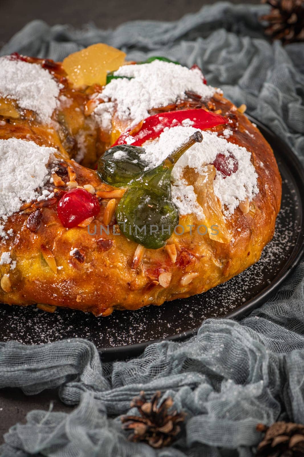 Bolo Rei or Kings Cake is a traditional Xmas cake with fruits raisins nut and icing on kitcthen countertop. Is made for Christmas, Carnavale or Mardi Gras