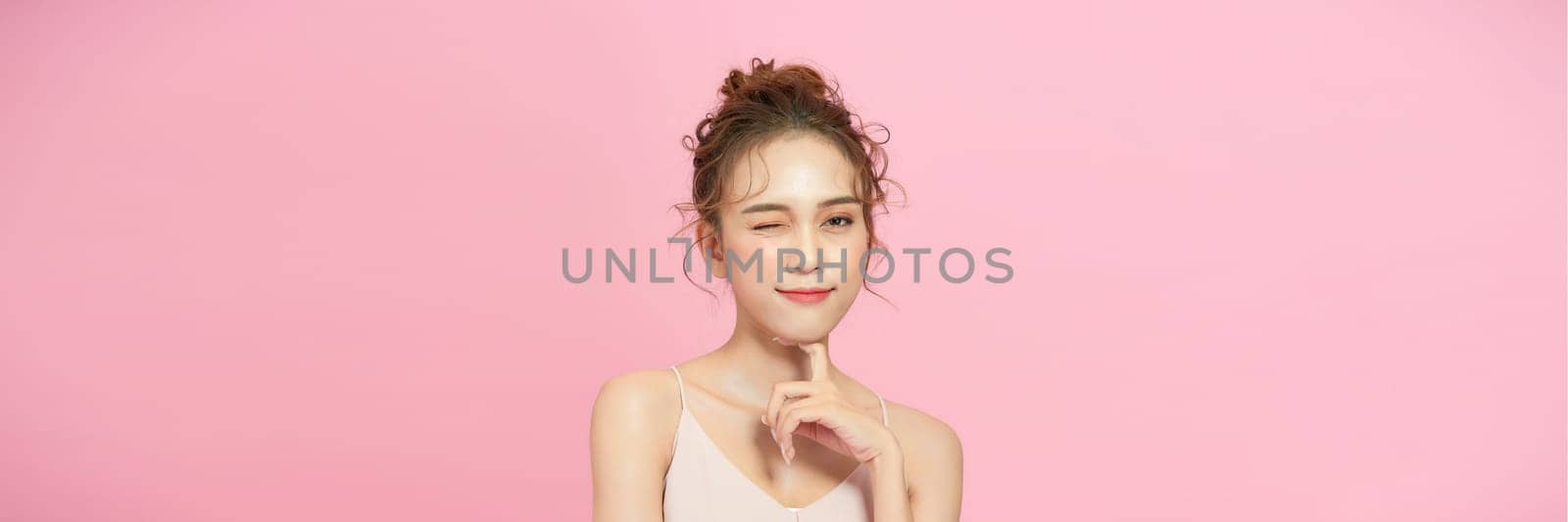Casual beauty concept of pretty Asian girl on pink background
