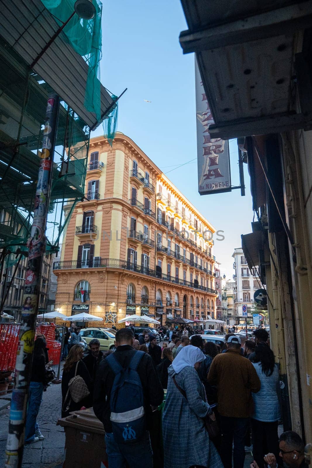 Napoli, Italy: 2023 November 18: People waiting on the street at La Antica Pizzeria Da Michele from 1870 where the authentic Margherita pizza is made in November 2023.