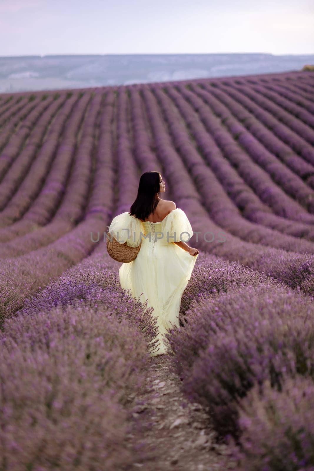 Woman lavender field. Lavender field happy woman in yellow dress in lavender field summer time. Aromatherapy concept, lavender oil, photo session in lavender by Matiunina