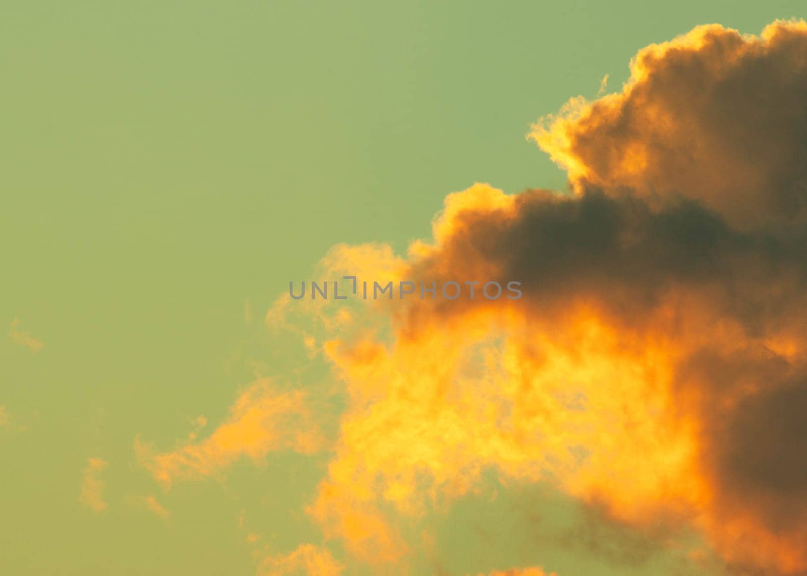 Beautiful nature sky with orange, yellow sunshine and fluffy clouds. Time lapse of beautiful golden sky at sunset or sunrise. by TEERASAK