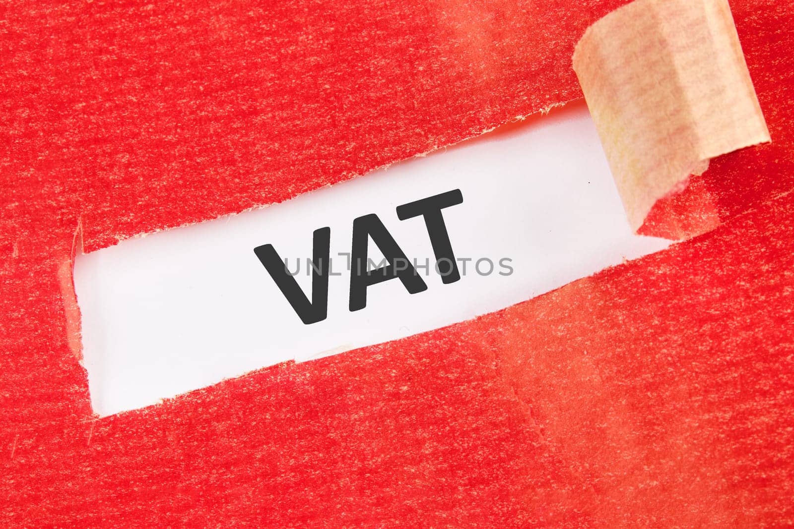 VAT the inscription under the torn paper on a white background
