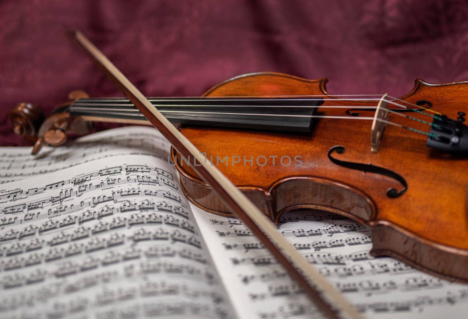 Beautiful violin and note sheets on purple background by iansaf