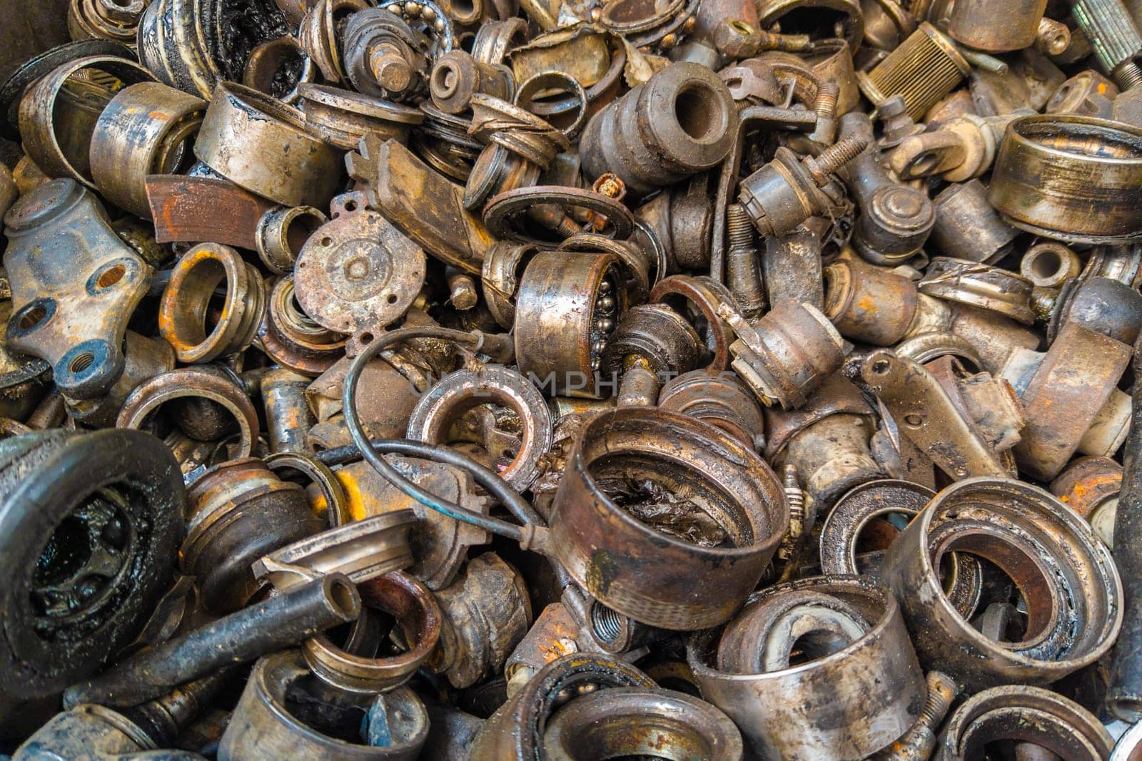 rusted steel scrap pile of used car parts and pieces by z1b
