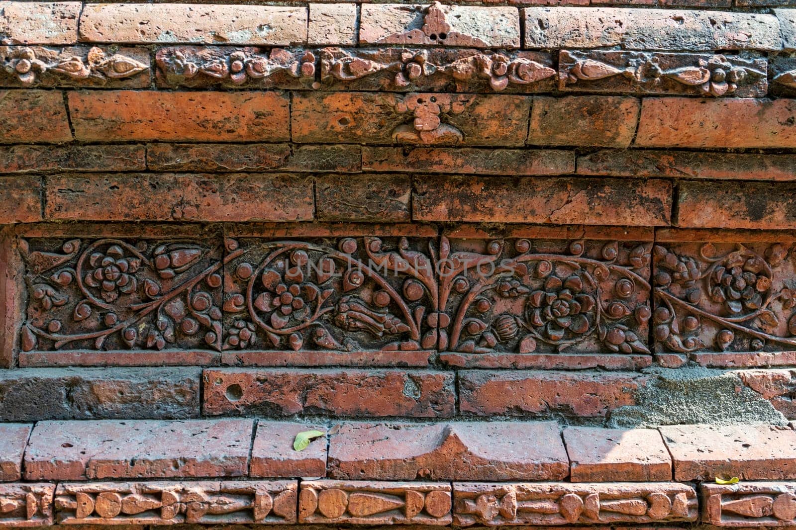 Terracotta patterns ancient stone carving, pattern on the stone wall of Bagha Shahi Mosque by paca-waca