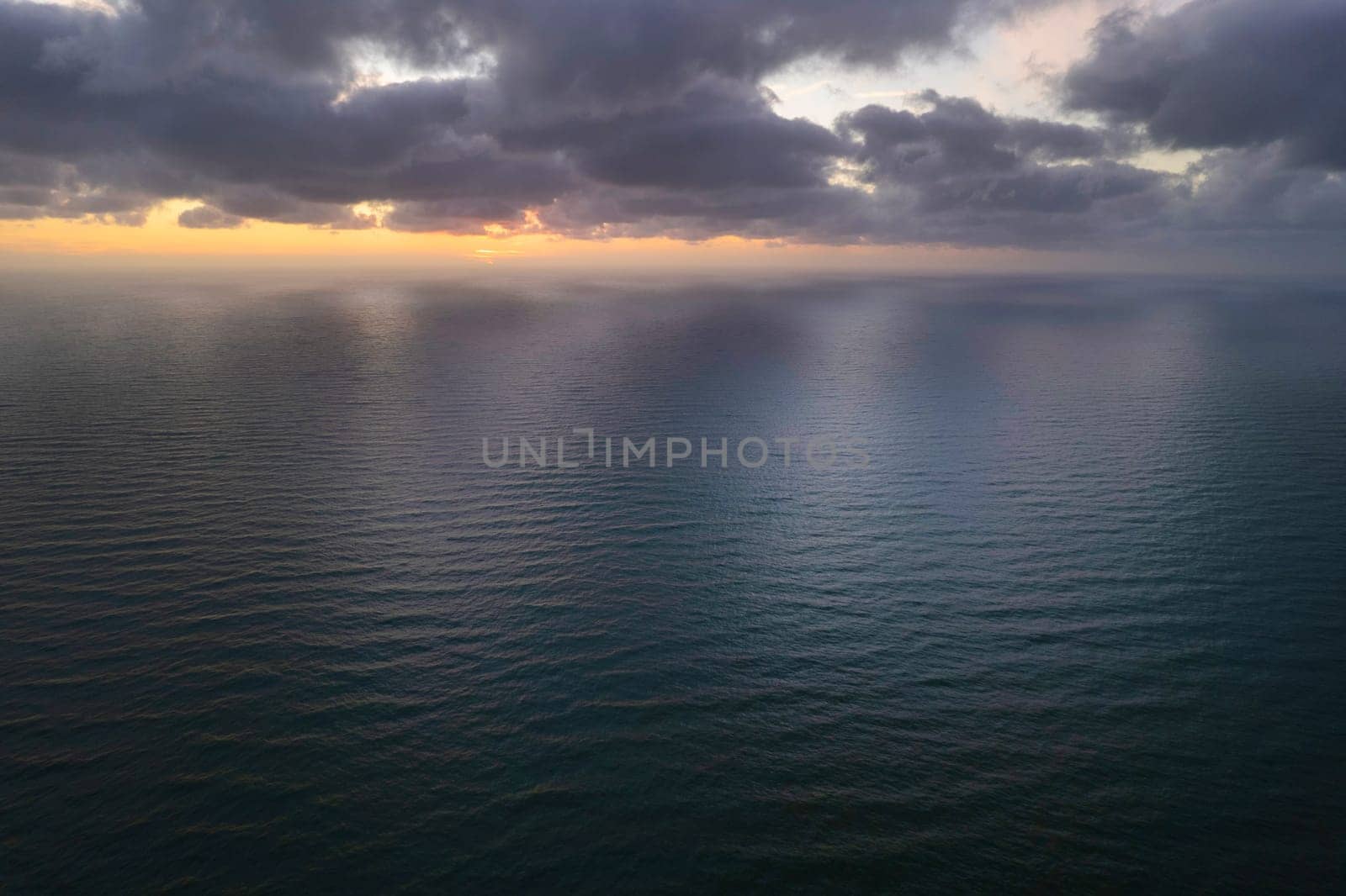 Aerial photographic documentation of a sunset over the Mediterranean sea 