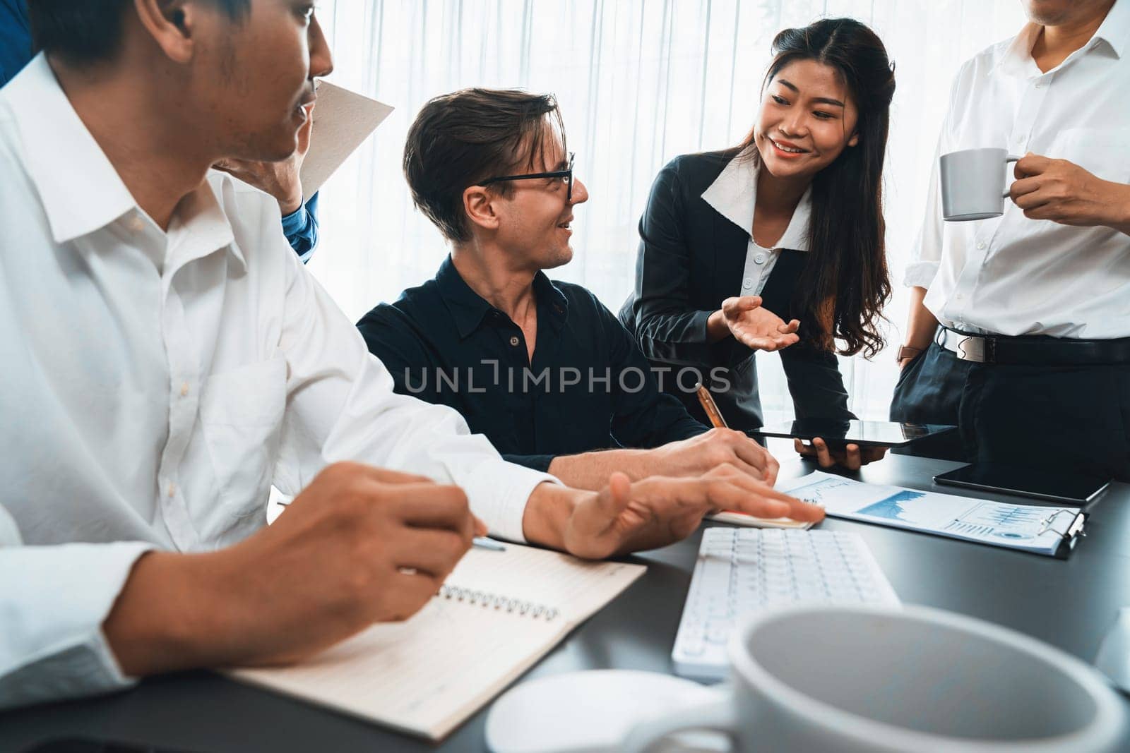 Group of diverse office worker employee working together on strategic business marketing planning in corporate office room. Positive teamwork in business workplace concept. Prudent