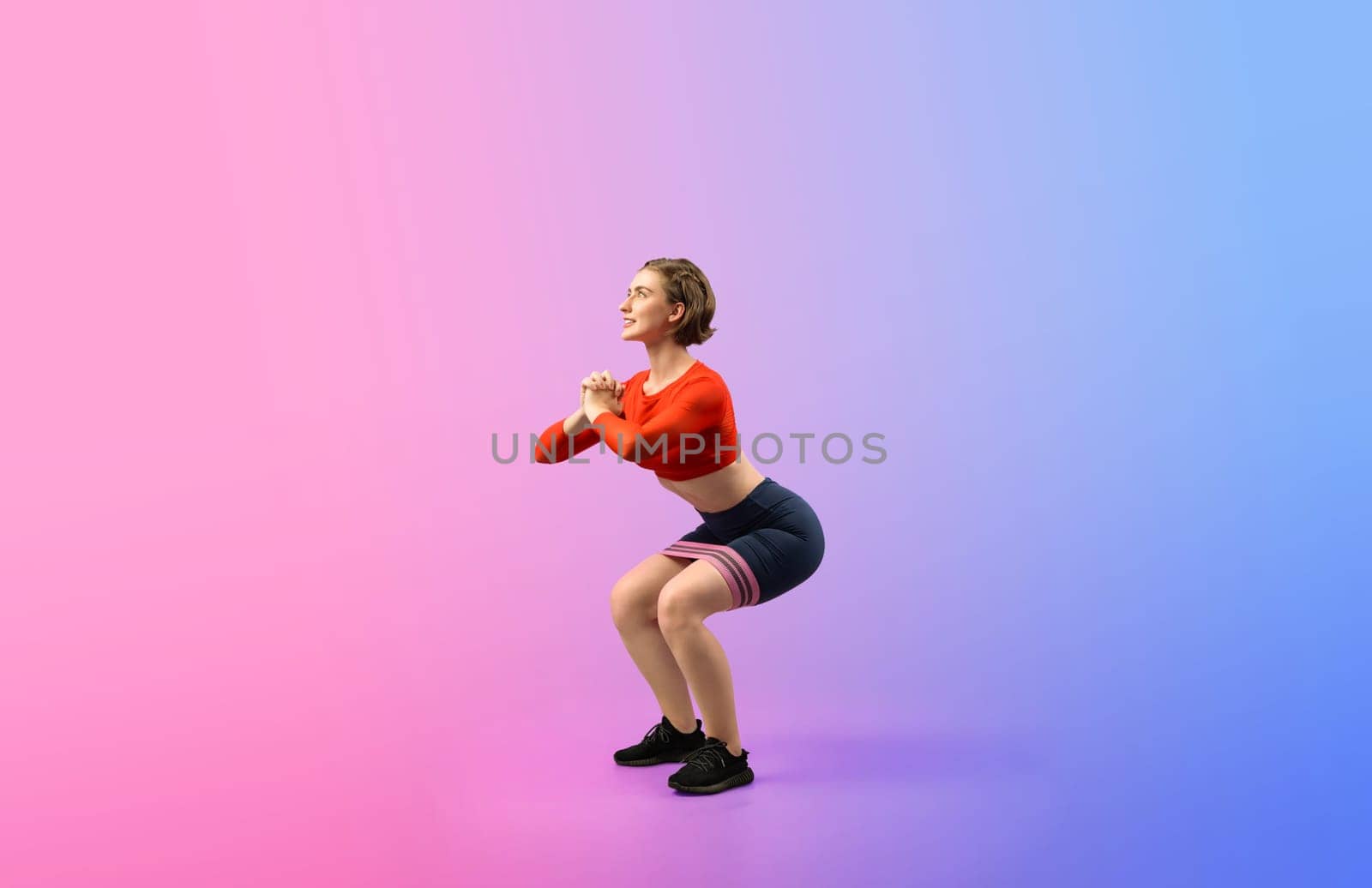 Full body length gaiety shot athletic sporty woman with kicking position posture by biancoblue