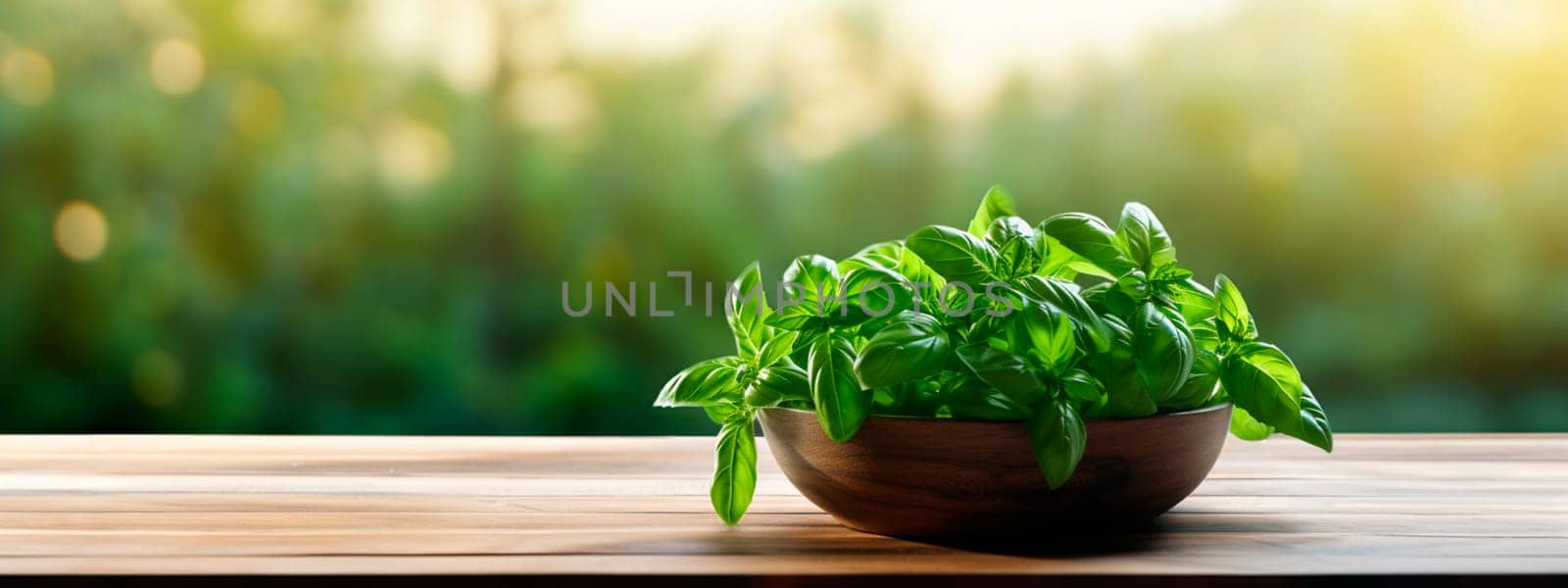 Basil harvest in a bowl on a garden background. Selective focus. Food.