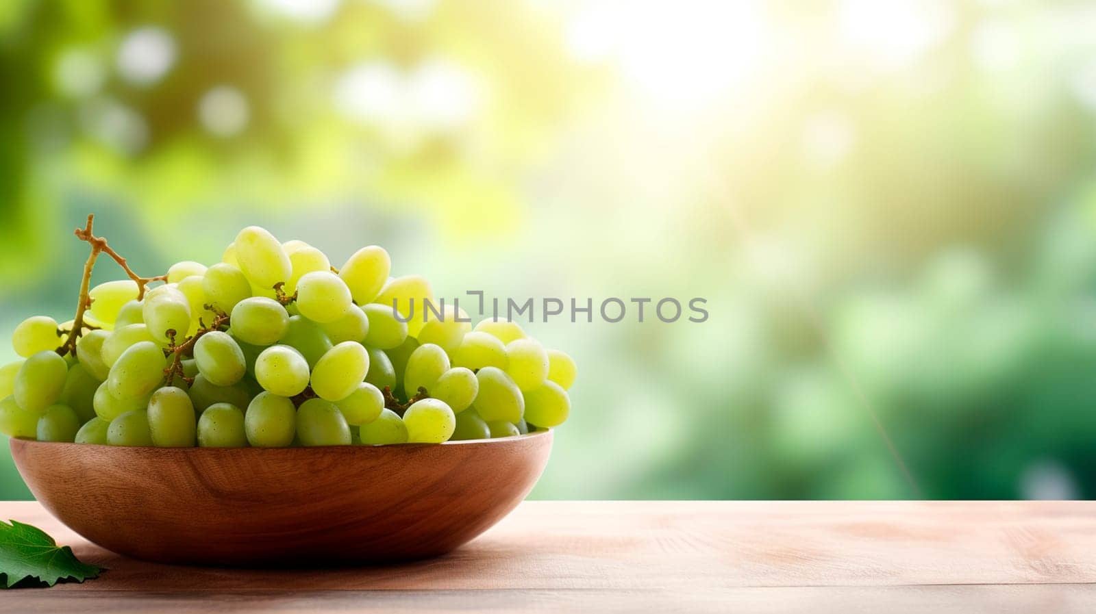 Grapes in a bowl against the backdrop of the garden. Selective focus. by yanadjana