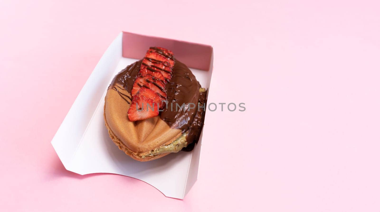 Design Cookie Genital Vagina, Vulva Shaped Waffle With Berries, Dark Chocolate In Paper Box On Pink Background. Festival Street Food. Copy Space For Text. Horizontal Plane, Top View. Copy Space.