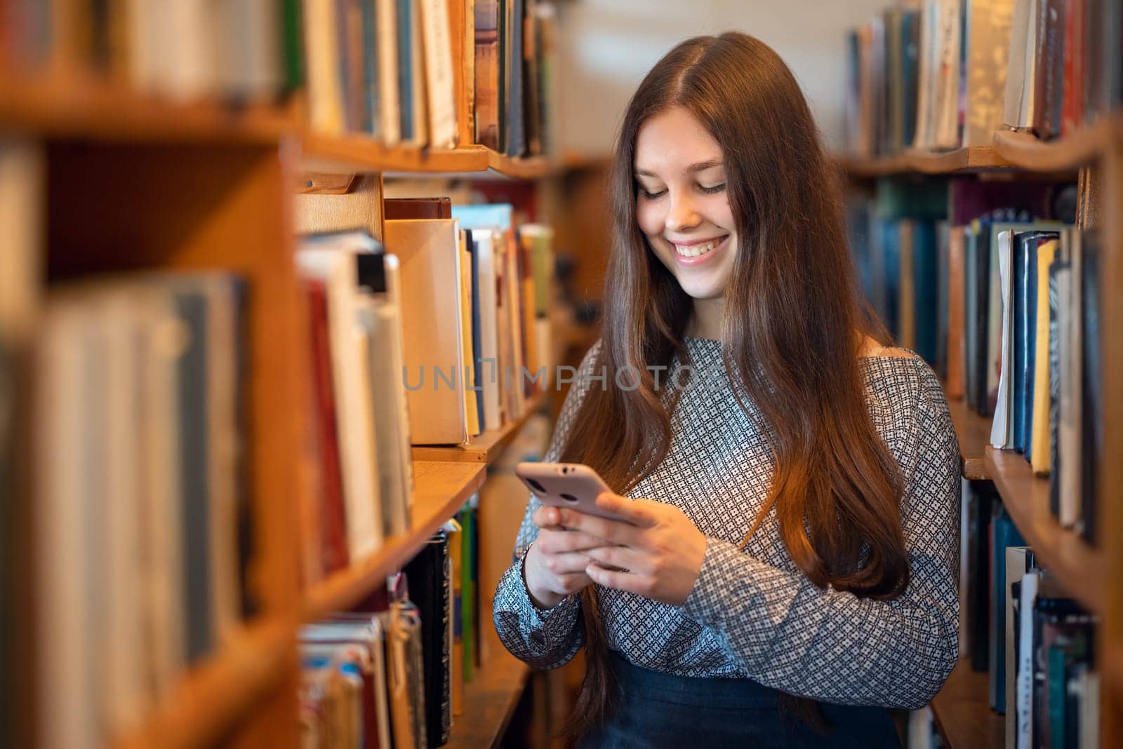 Portrait of a student girl using phone