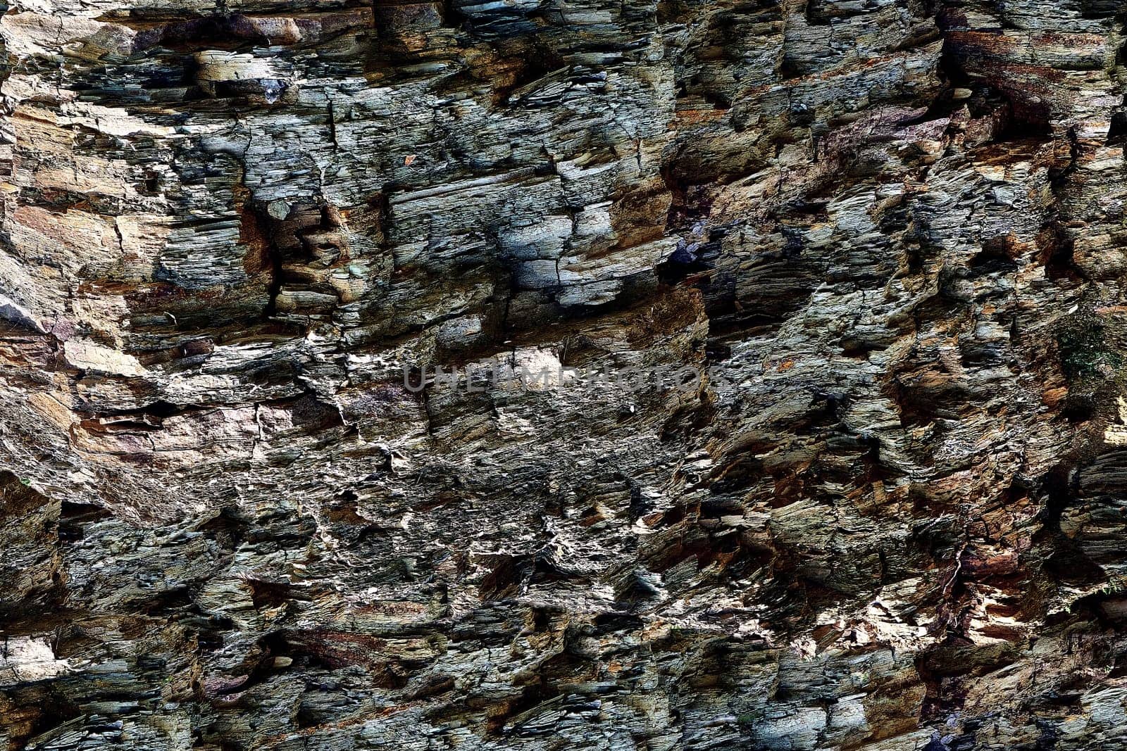 Stone gray brown crumbling rock formation background by jovani68