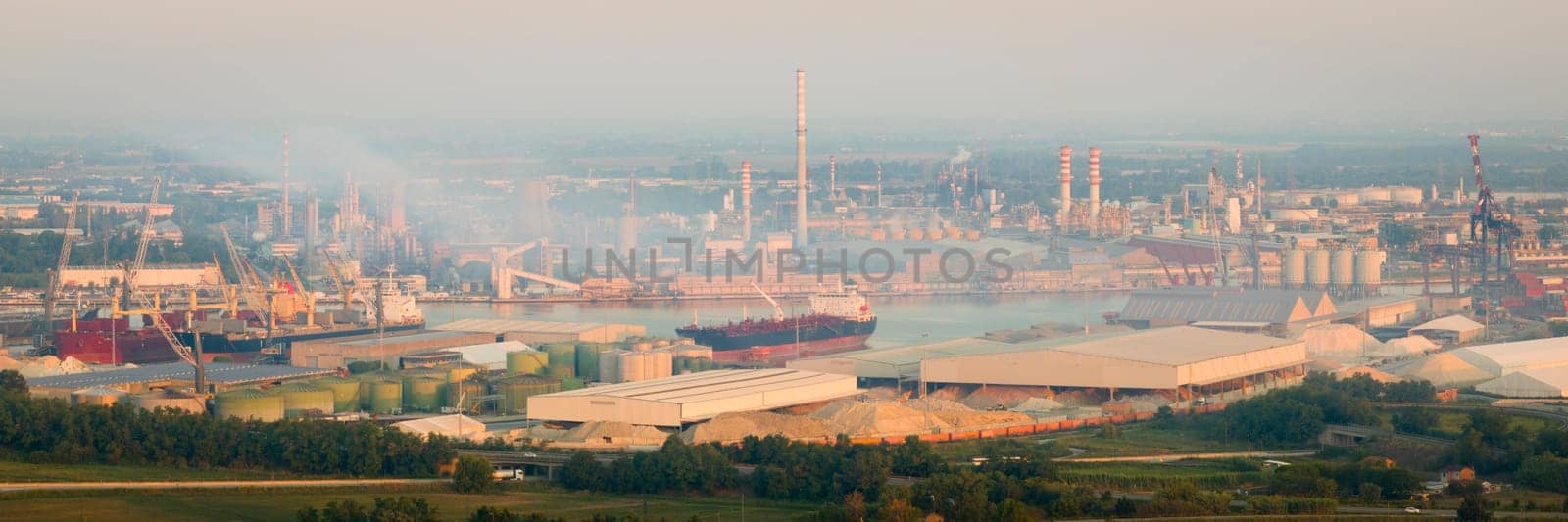 Drone shot of industrial and port area of Ravenna,production district is made up of a chemical and petrochemical pole, thermoelectric and metallurgical plants.