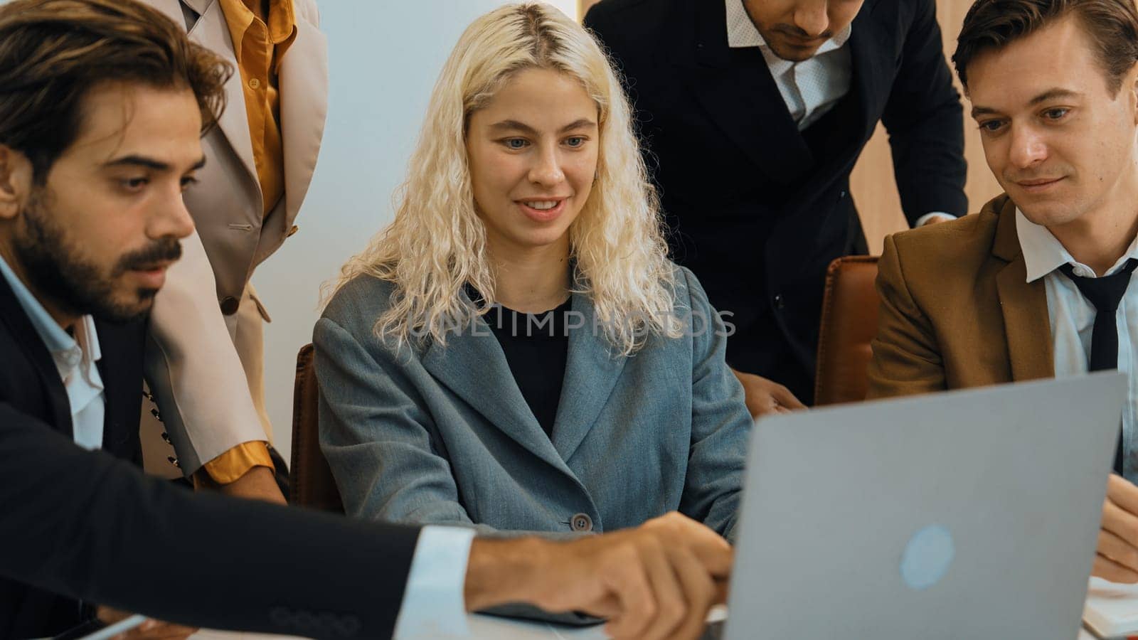 Diverse office worker employee working and brainstorm on strategic business marketing planning. Teamwork and positive attitude create productive and supportive in ornamented business office workplace.