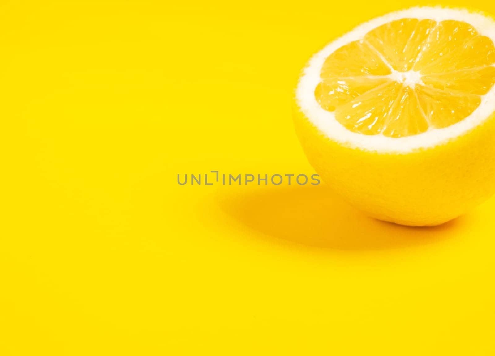 lemon fruits. Juicy slice of lemon on yellow background isolated. panoramic mock up image. Yellow lemon close up. place for text. Fresh cut lemon. High quality photo
