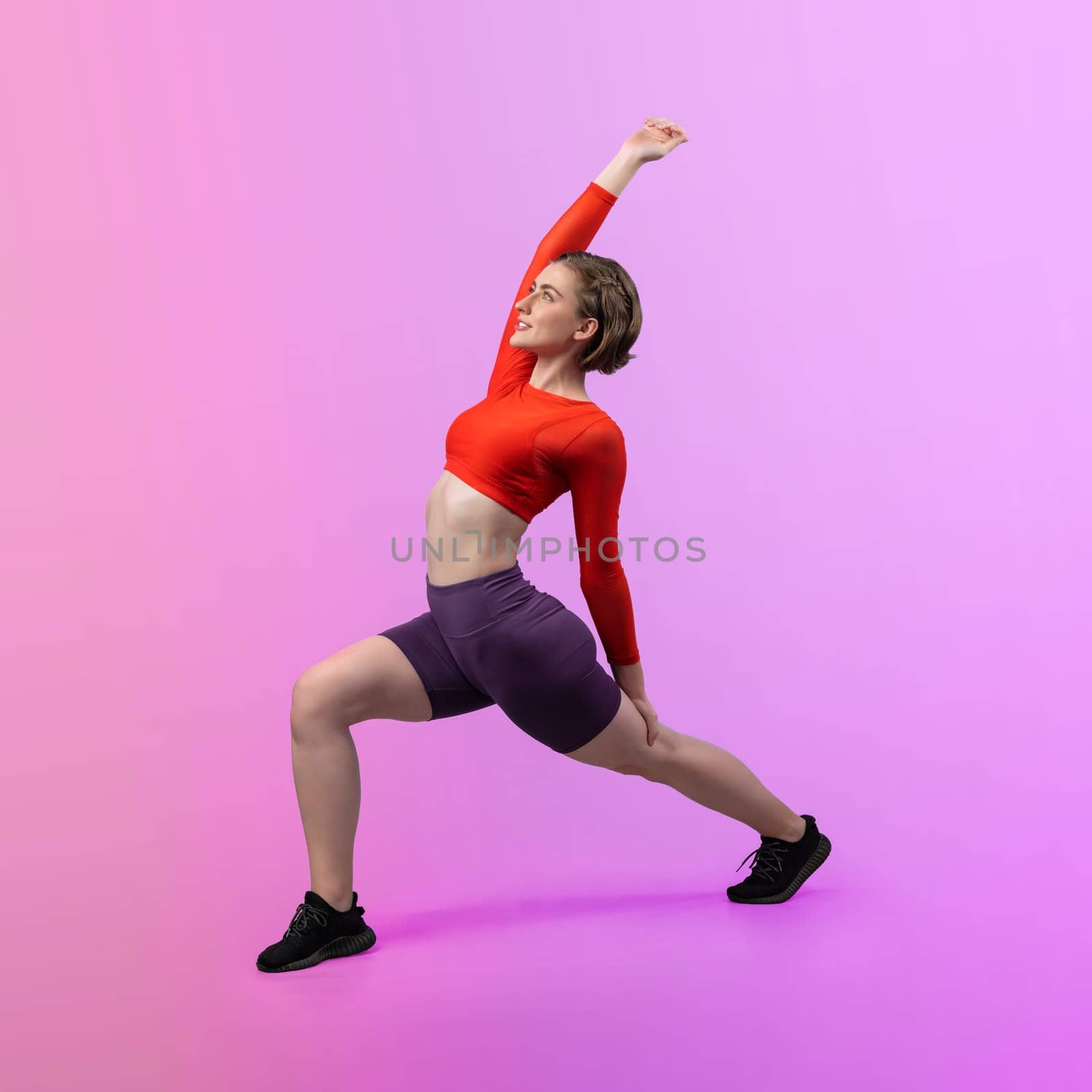 Full body length gaiety shot athletic and sporty woman doing yoga by biancoblue