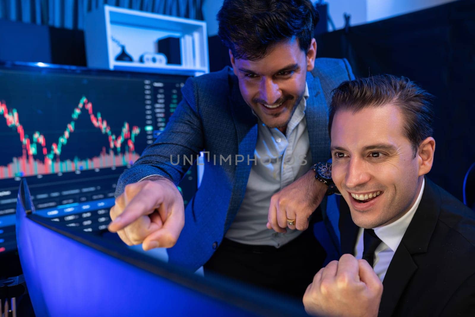 Successful two stock exchange traders raising fist up. Sellable. by biancoblue