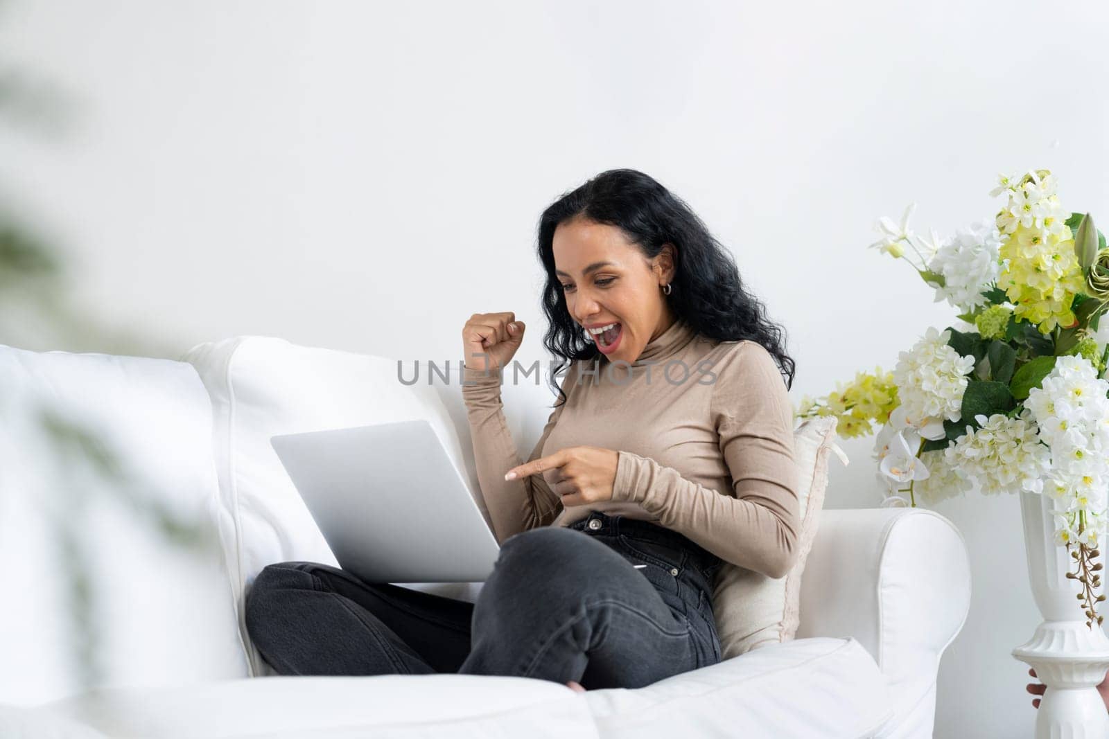 Successful African-American businesswoman feel happy at crucial work on laptop by biancoblue