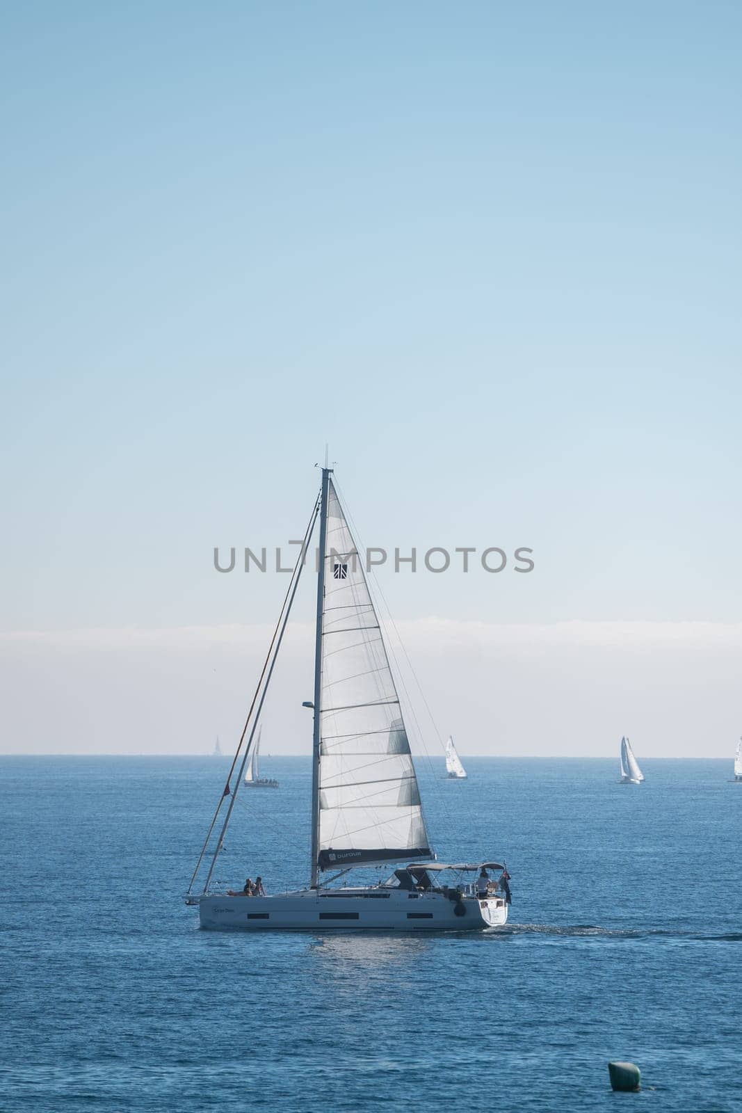 Sailboat in Barcelona from La Barceloneta in the capital of Catalonia in Spain in 2023. by martinscphoto