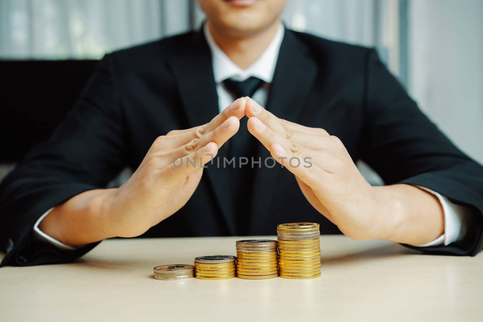 Businessman working with coin money currency. Concept of investment growth and money saving. uds