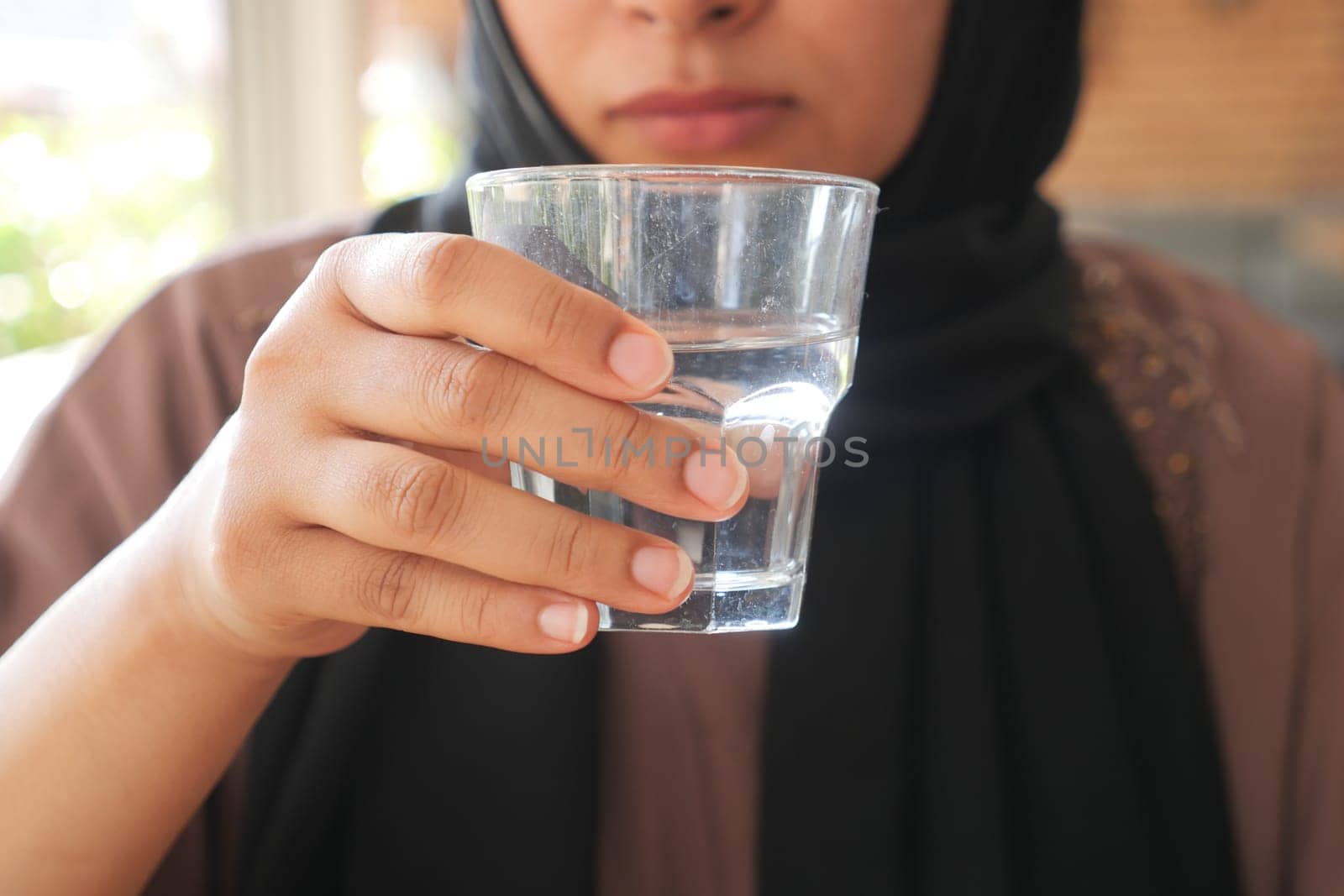 young women drinking glass of water ,