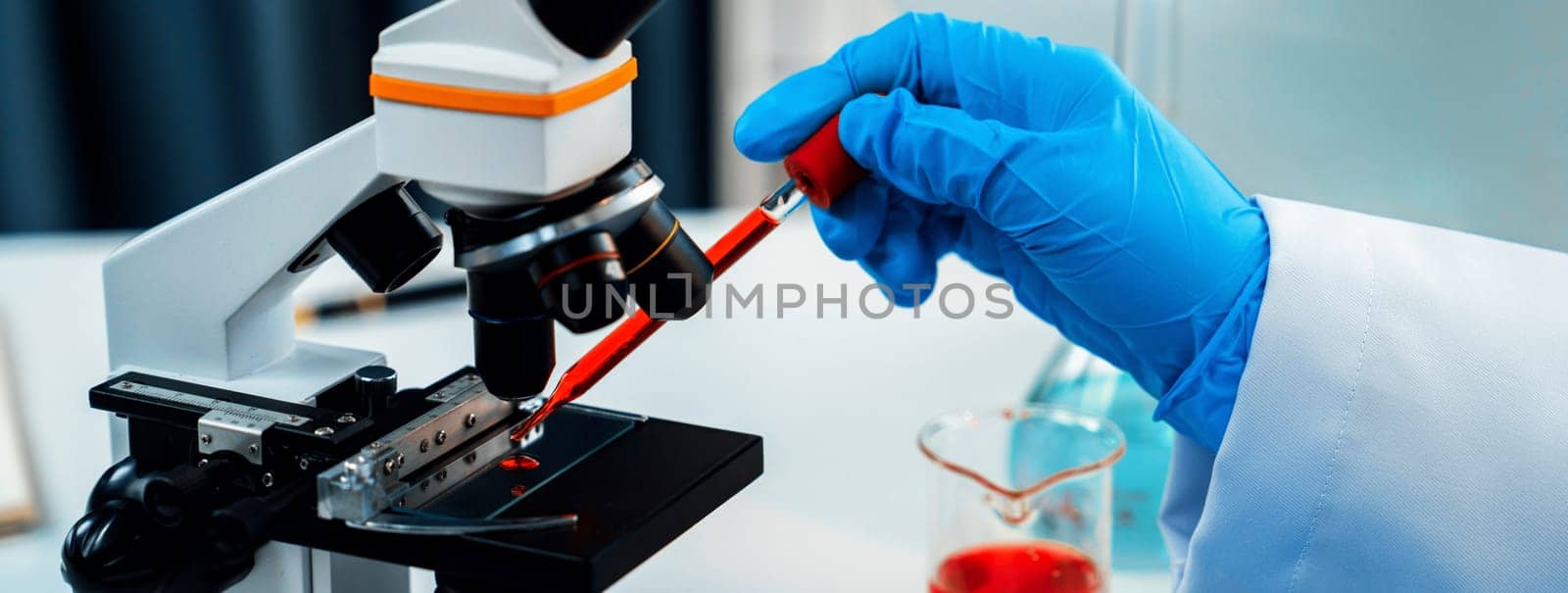 Laboratory researcher develop new medicine or cure using microscope. Technological advance of healthcare with scientific expertise with laboratory microbiology equipment. Panorama Rigid