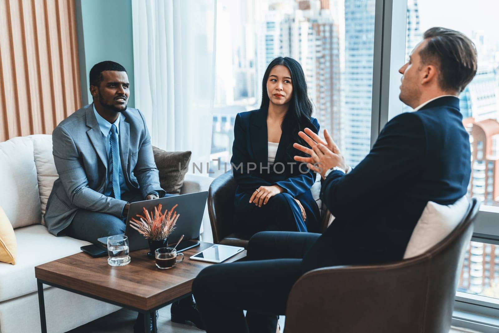 African businessman present start up project to expert investor. Group of multicultural business team solving problems, discussing business idea with skyscraper at modern business lounge. Ornamented