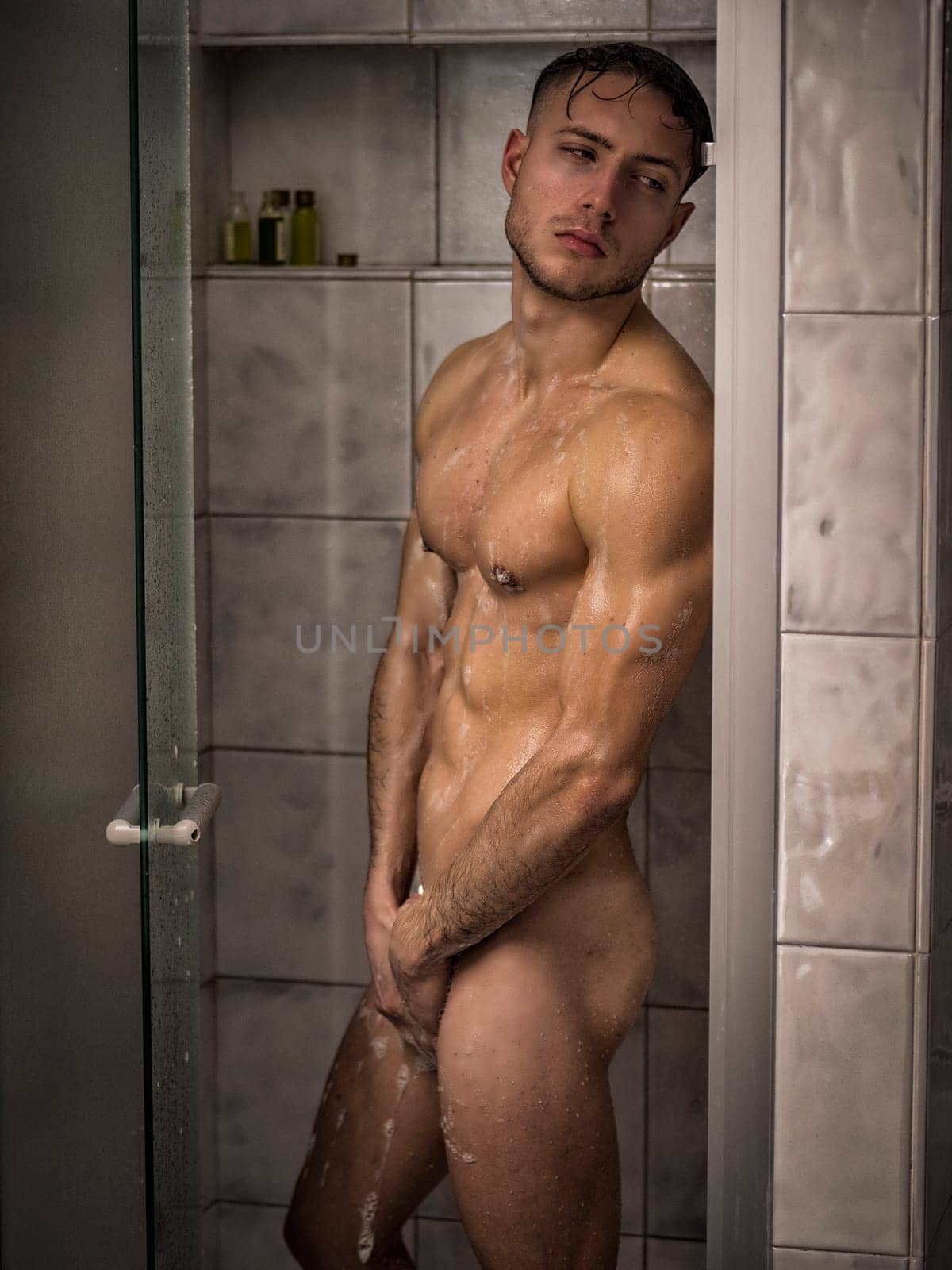 Naked Athletic Handsome Young Man Taking Shower by artofphoto