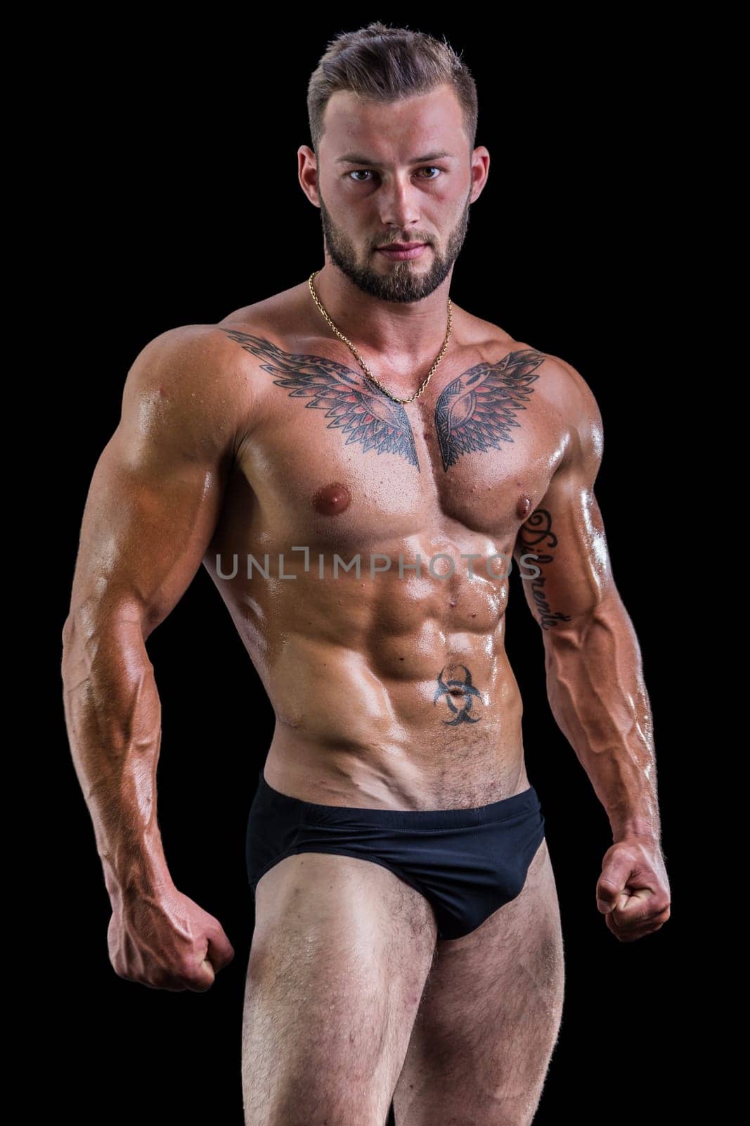Handsome topless muscular man standing, isolated by artofphoto
