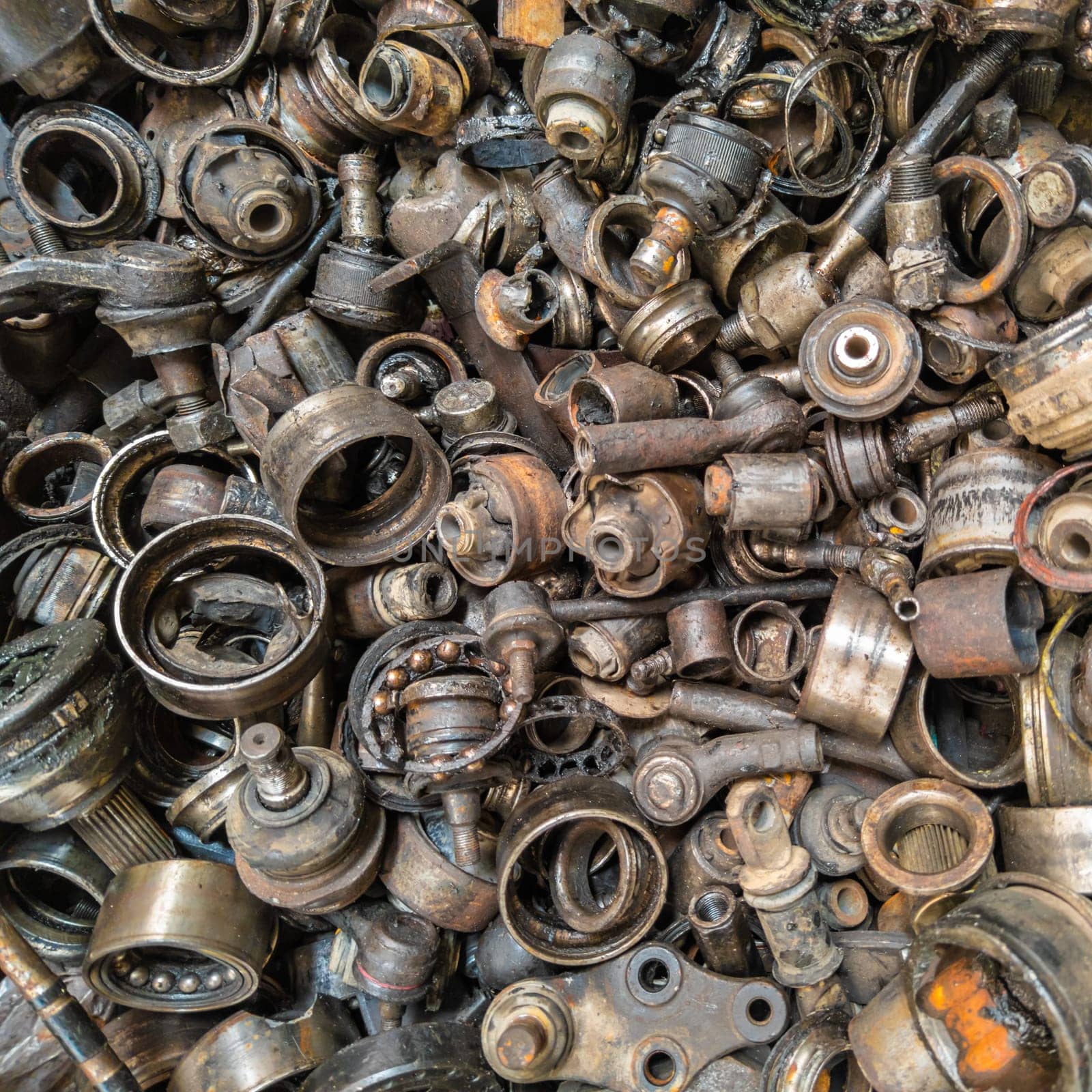 rusted steel scrap pile of used car parts and pieces by z1b