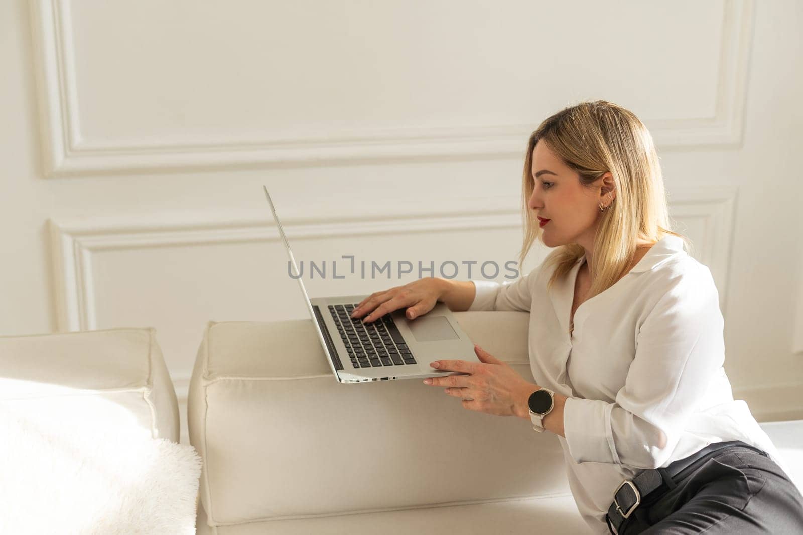 Beautiful business woman at her personal office working on her desk. . High quality photo