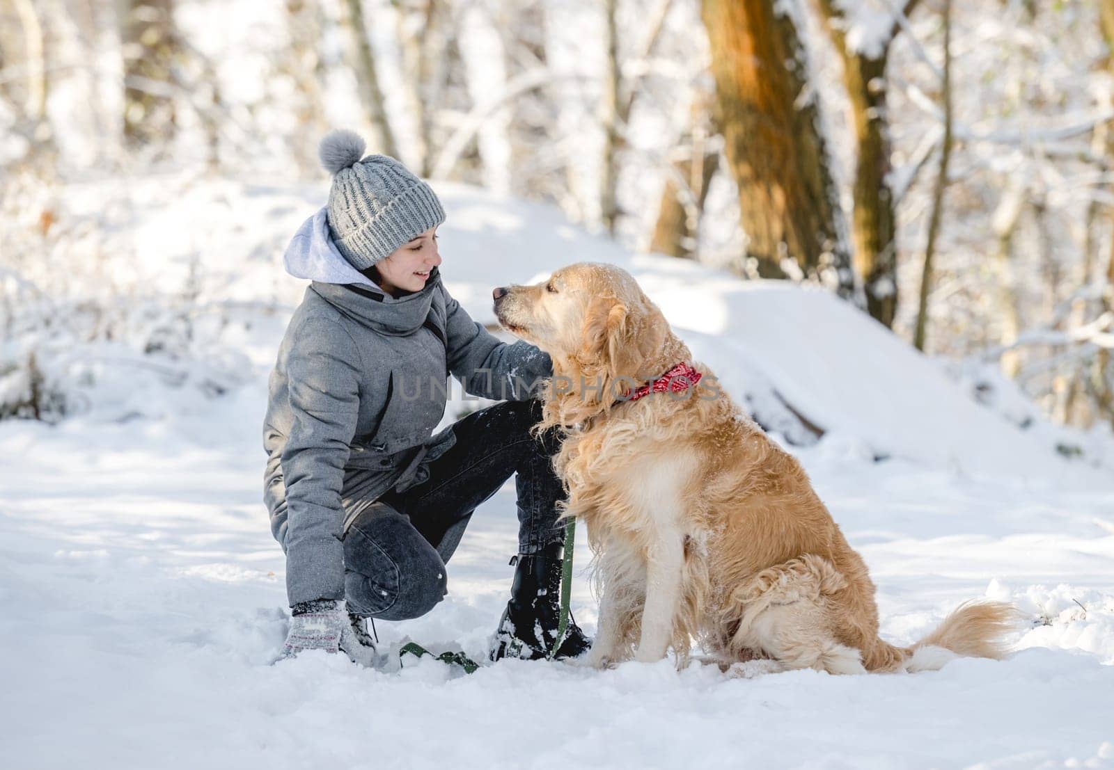 Teenage Girl And Golden Retriever In Winter Forest by tan4ikk1