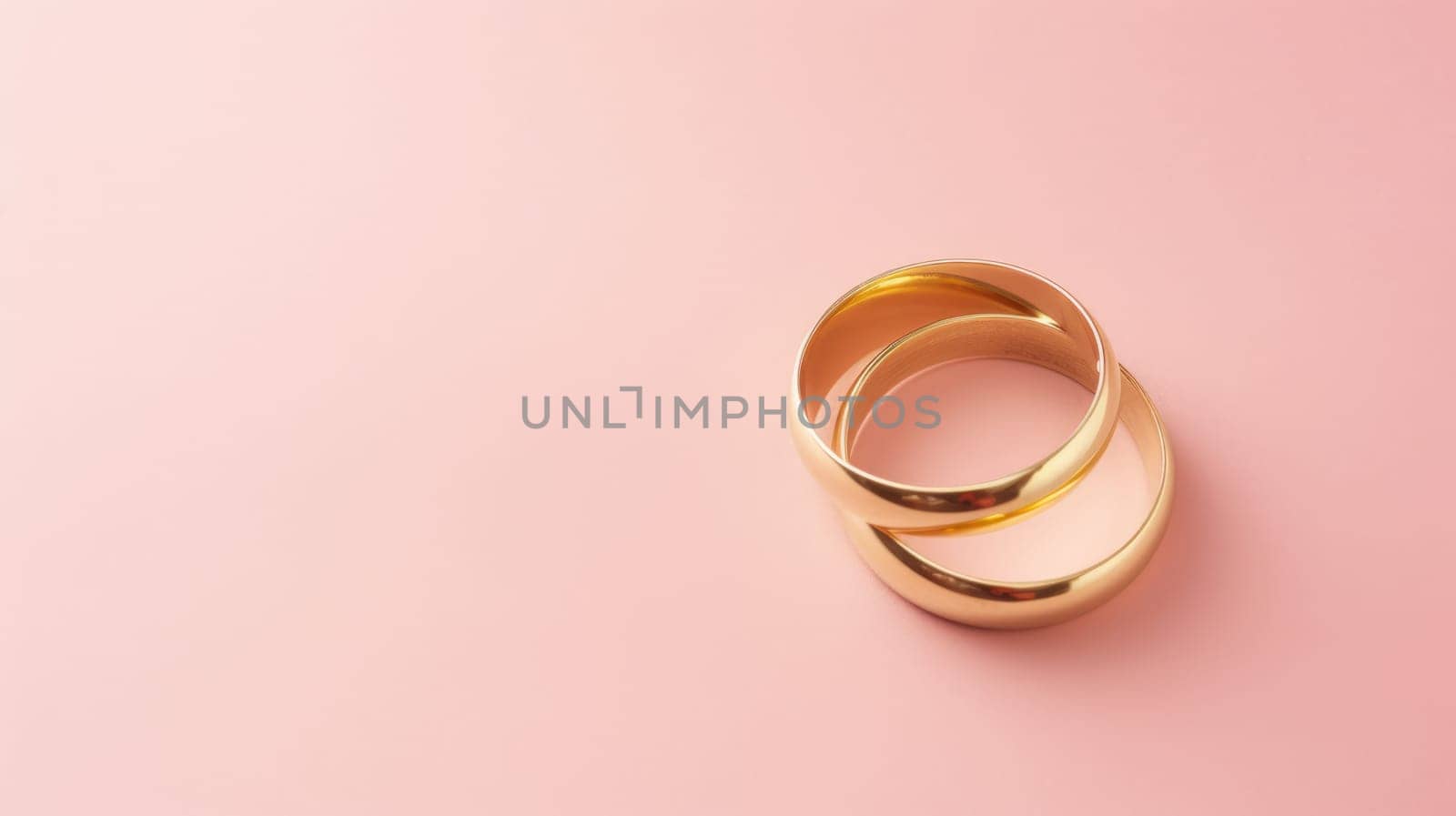 Pink pastel background with copy space and wedding golden rings by natali_brill