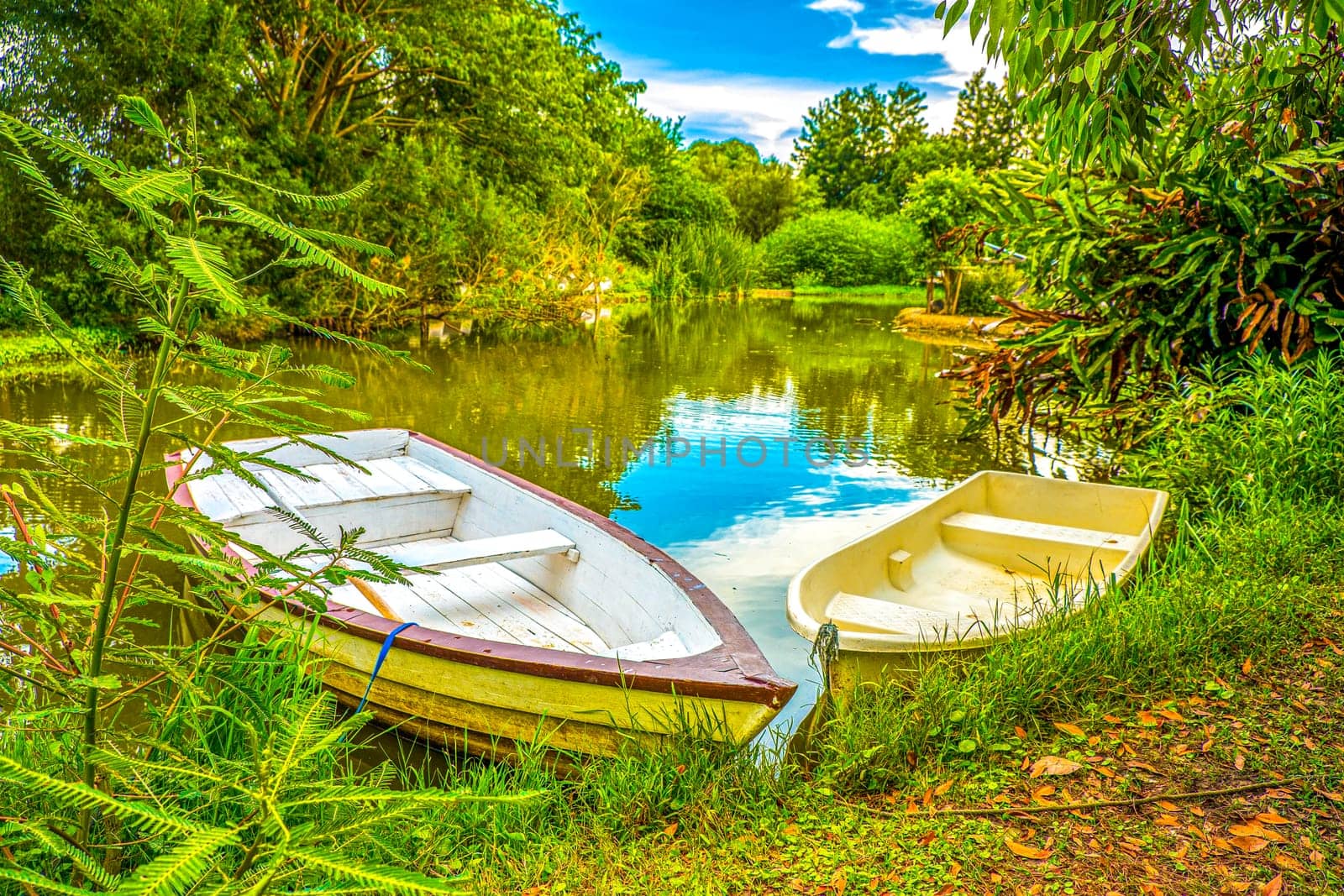 The beautiful landscape ofmall wooden rowing boat on a calm lake.